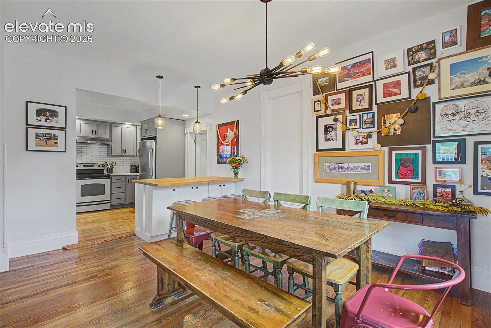 Dining area featuring wood-finish flooring and an open concept layout