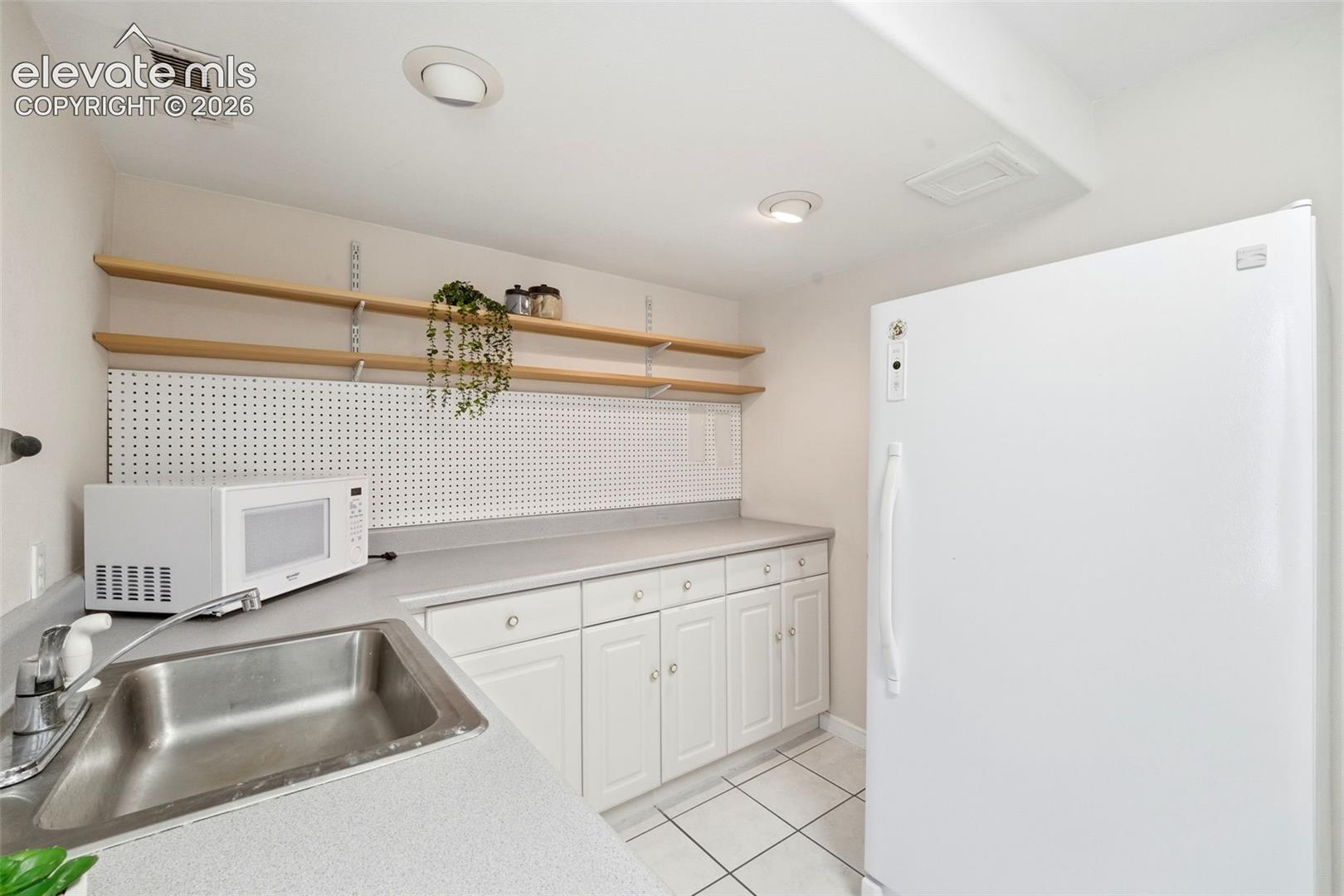 Cabinetry and sink create an ideal setup for multi-generational living