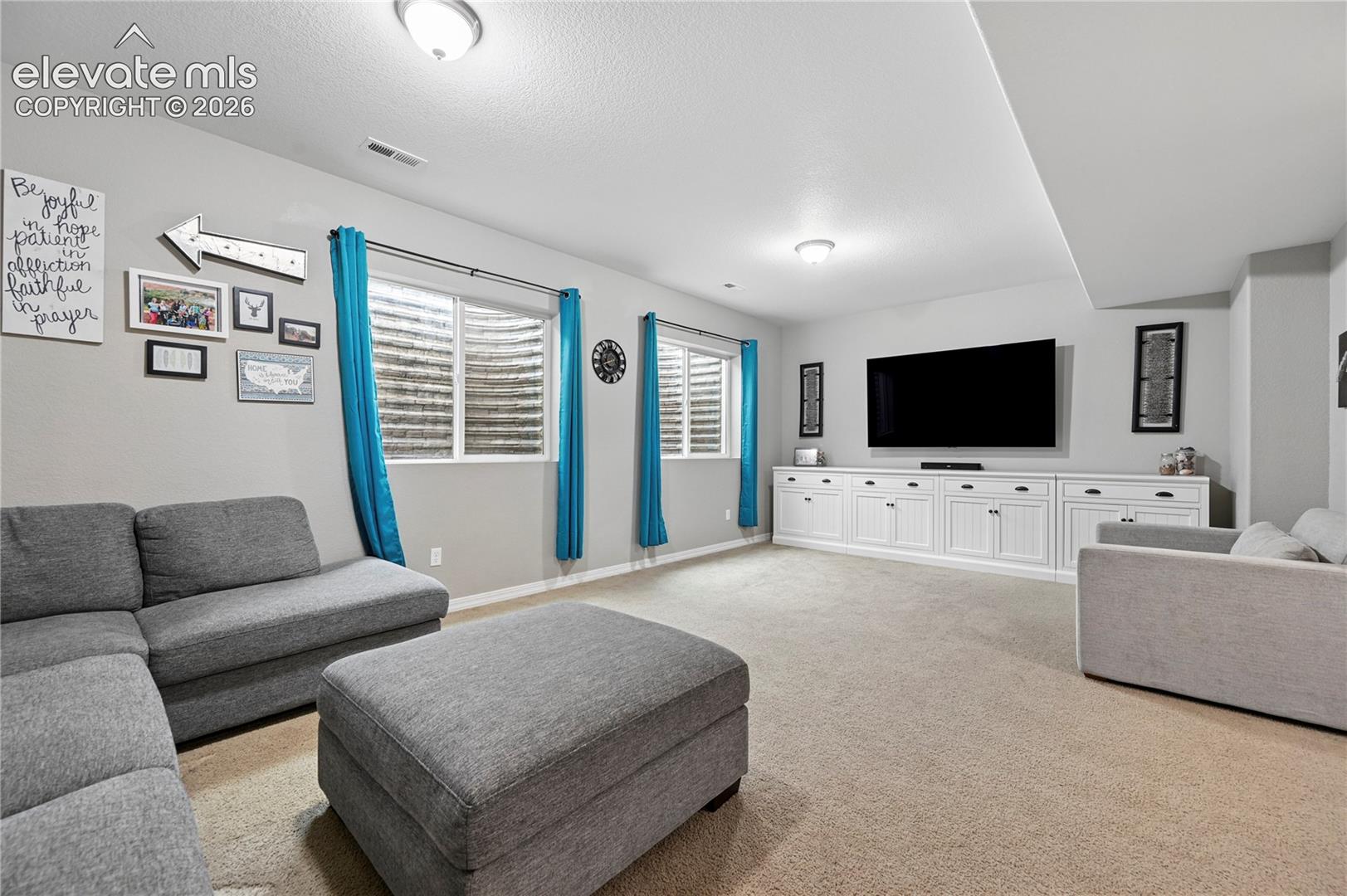 The over-sized family room in the basement with its high ceilings is plenty big enough for enjoying Fall football on the big screen and still having room to play ping-pong, foosball, or having a building-block area whose familiar brand we can't mention by name.