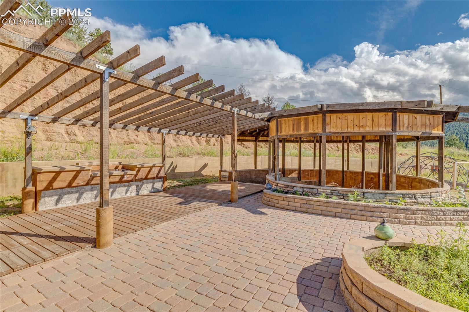 View of patio with a pergola