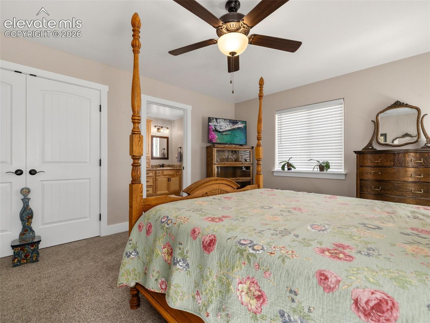 Neutral-toned walls complement plush carpeting