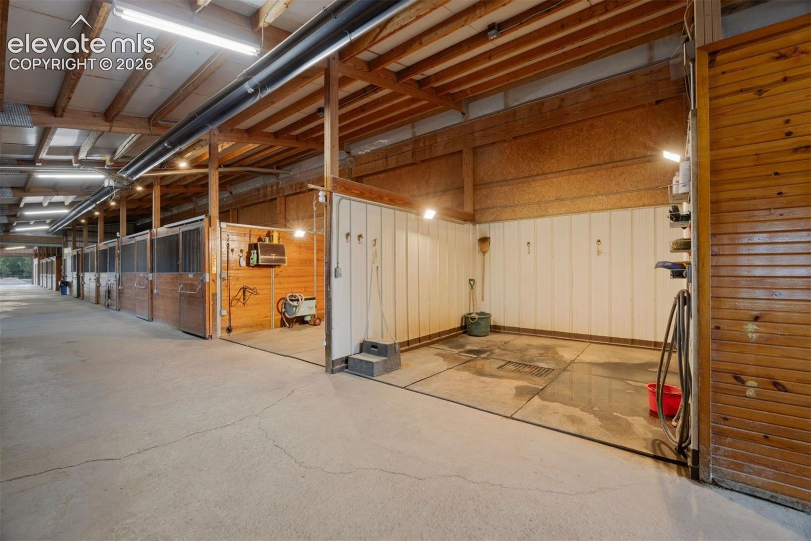 Two wash stalls and three grooming stalls, plus a dedicated grain room, tool room, and two additional storage rooms. 