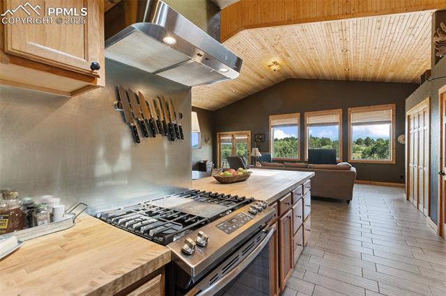 Ceramic flooring, Tiled and Wood countertops. 