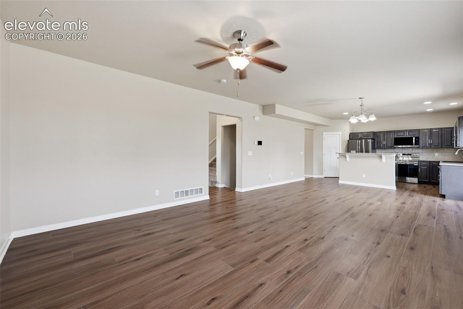 An open layout keeps the living, dining and kitchen spaces connected while still giving each area its own identity.