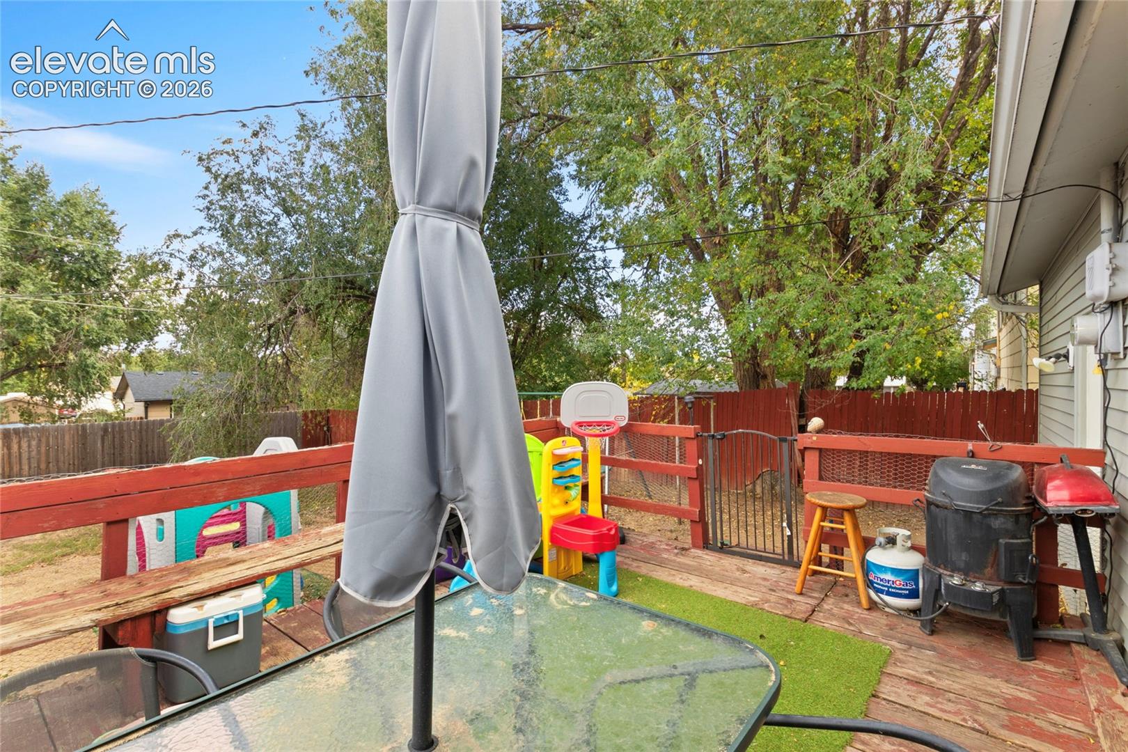 Deck with view of backyard