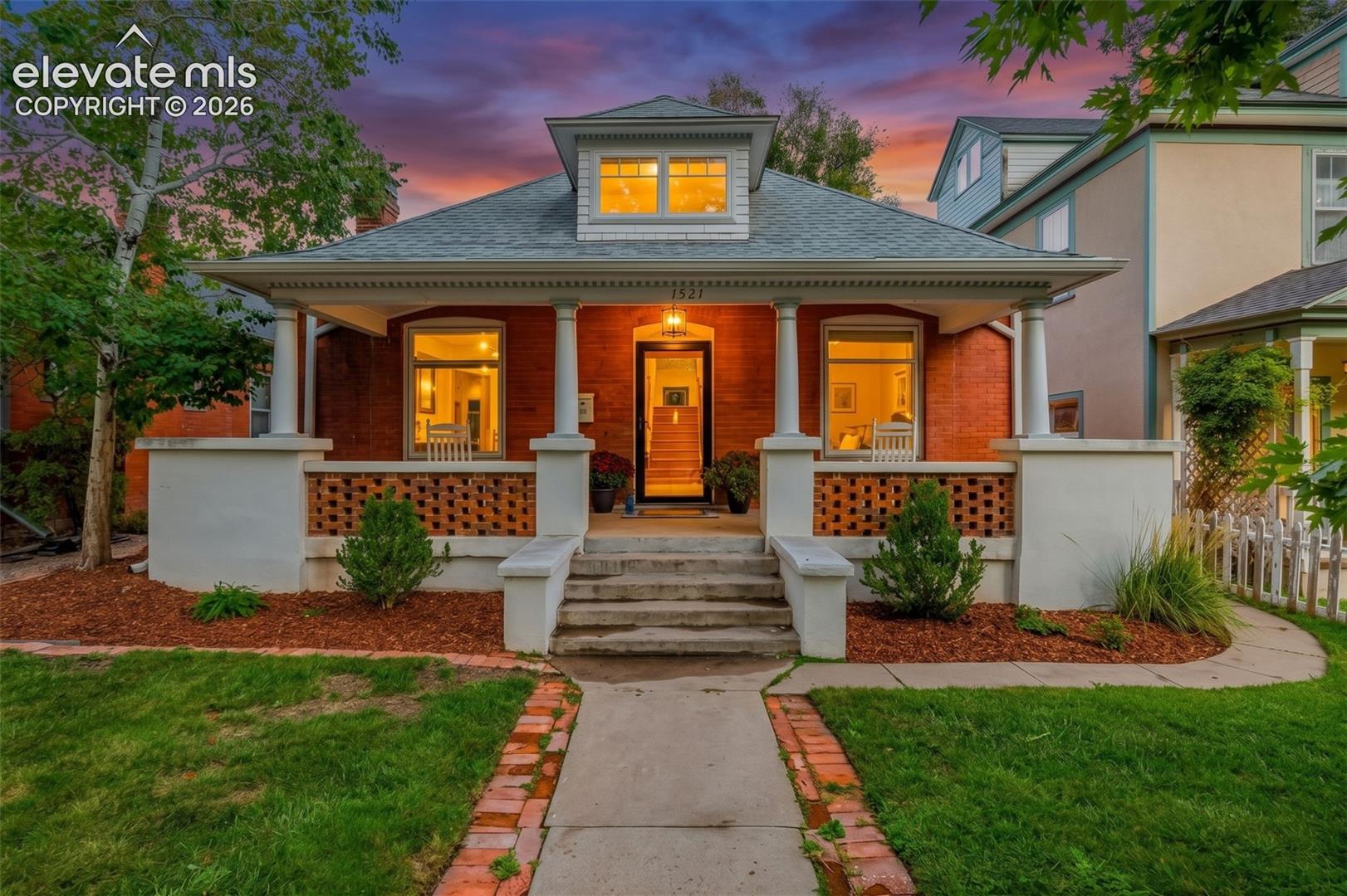 RARE 1901 BRICK VICTORIAN in the historic Old North End with the ONE thing you almost never find this far north - a DETACHED 2-CAR GARAGE! Wide front porch made for lemonade (or cocoa!) on one of the North End's beautiful tree-lined streets * Meticulously and lovingly renovated by the owners - all the delightful charm you'd hope for in a classic Old North End home, with the updating already done for you * MAIN LEVEL boasts gorgeous fir hardwood floors, original doors, hardware and knobs, incredible original wood trim around every doorway and window, high ceilings, and updated light fixtures throughout * Family room centers around the original gas fireplace with green glazed tiles, flanked by antique leaded beveled-glass windows * Kitchen offers granite slab counters, gas range, new stainless refrigerator, and wood-look LVP floors * Main level full bath with shower/tub combo, main-level laundry, walk-in pantry, walk-in closets, and floor-to-ceiling original built-ins in the hallway * Three bedrooms on the main level, plus a new mudroom off the back with built-in cabinets, butcher-block counters, bench, and black penny-tile floor * UPSTAIRS, an oversize Primary Suite spans the upper level with bonus office area, large walk-in closet, and decadent bath with heated floors, gold fixtures, and new shower * Large window seat, new carpet, new windows and skylights, mini-split A/C, and an antique window preserved to pull hallway light into the bath complement this insane Primary Suite! * Exposed brick and old wood beams at the top of the stairs add extra character * Bonus BASEMENT space for storage, hobbies, or a workshop * Large private fenced backyard with mature landscaping, raised veggie/garden beds, big deck for outdoor dining and entertaining, and sprinkler system * Newer forced-air furnace (2019) * Minutes to downtown and Monument Valley Park, Shooks Run and all the fun that the downtown and Old North End offer. Historic charm at its very BEST!