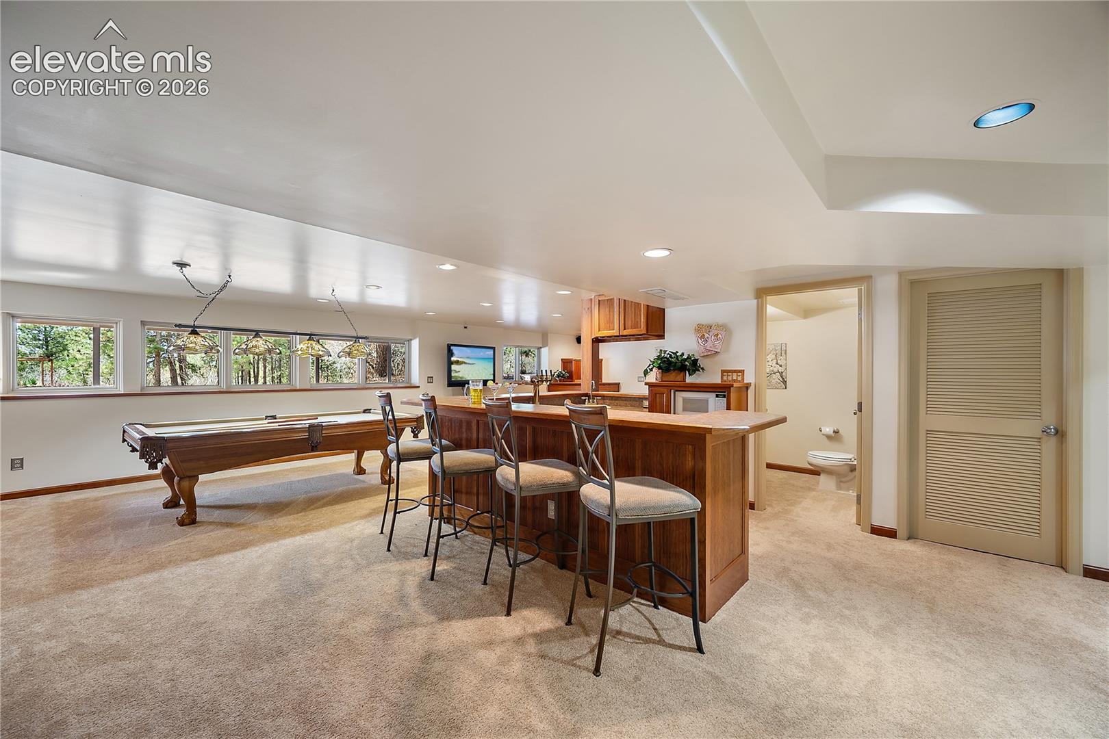 Rec room with wet bar. 