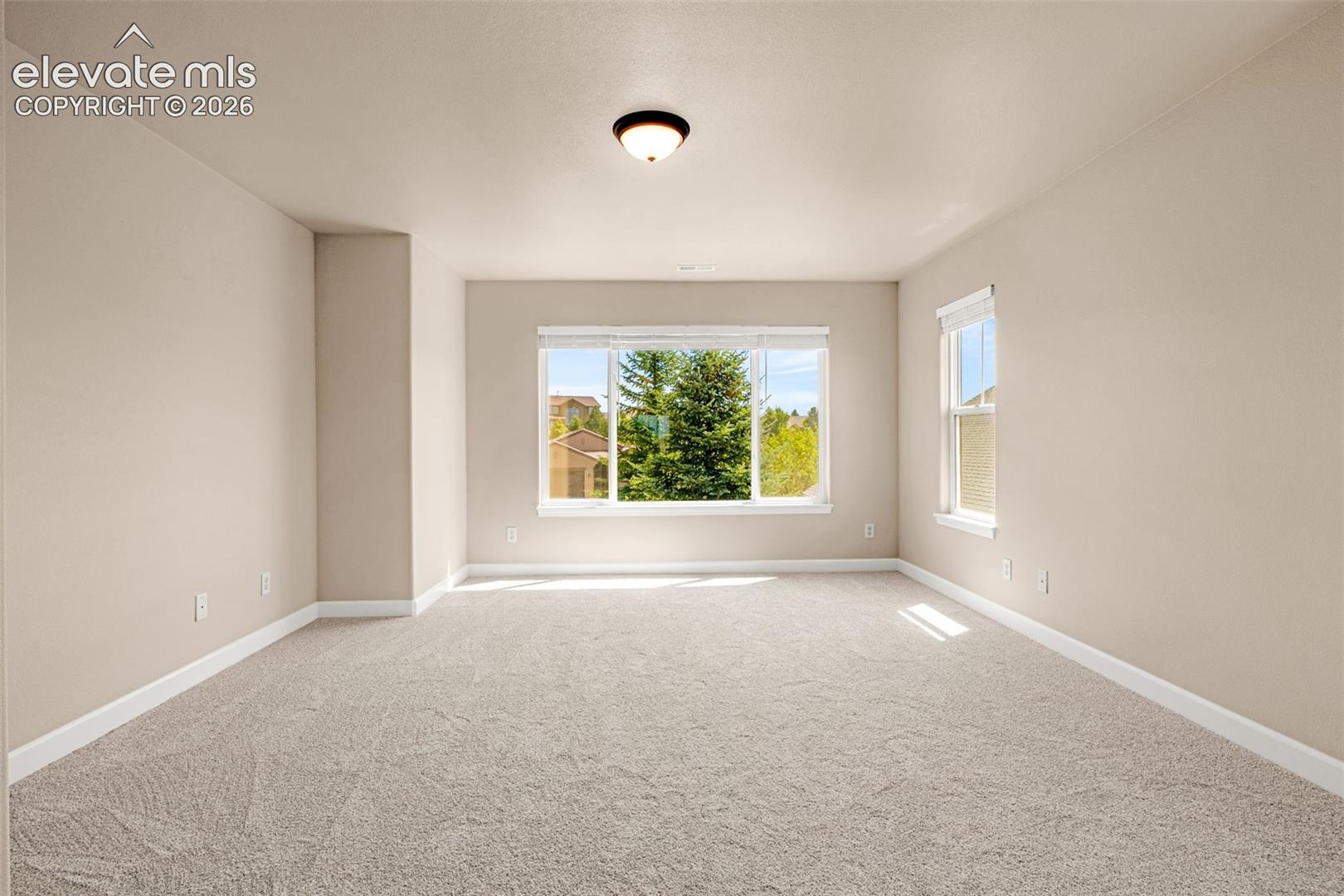 Primary suite or Owner's Retreat has new carpet, new baseboards, new blinds, new light fixtures, large on-suite and separate furnace and A/C controls.  