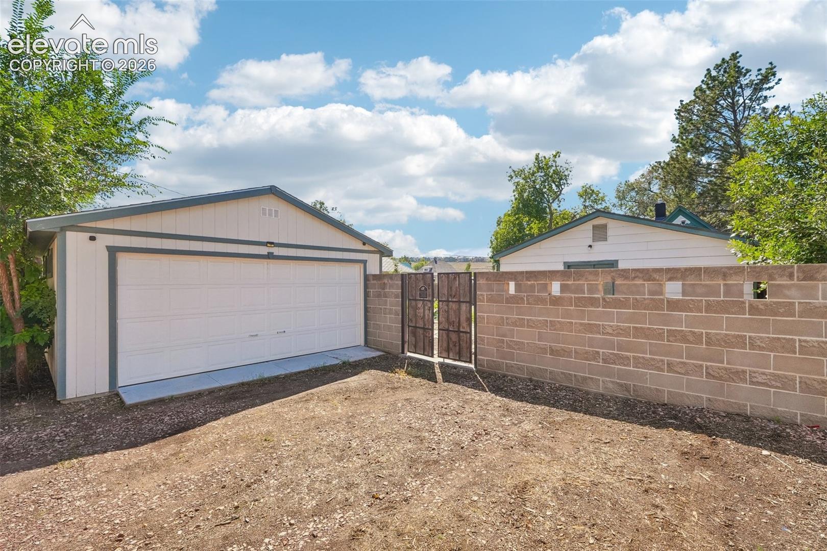 Alley access to ample parking and 2 car detached garage