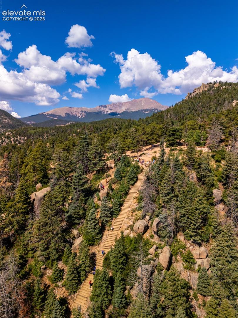 Located just minutes from the home, the legendary Manitou Incline is one of Colorado's most challenging and iconic hiking experiences. Originally a cable railway, this steep mountain trail features 2,768 steps and climbs nearly 2,000 vertical feet in less than one mile. The Incline connects with Barr Trail, which leads to the summit of Pikes Peak, visible in the background, and rewards hikers with spectacular panoramic views of Manitou Springs and the surrounding mountains.