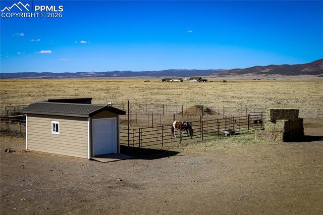 Corral, loafing shed, & storage shed