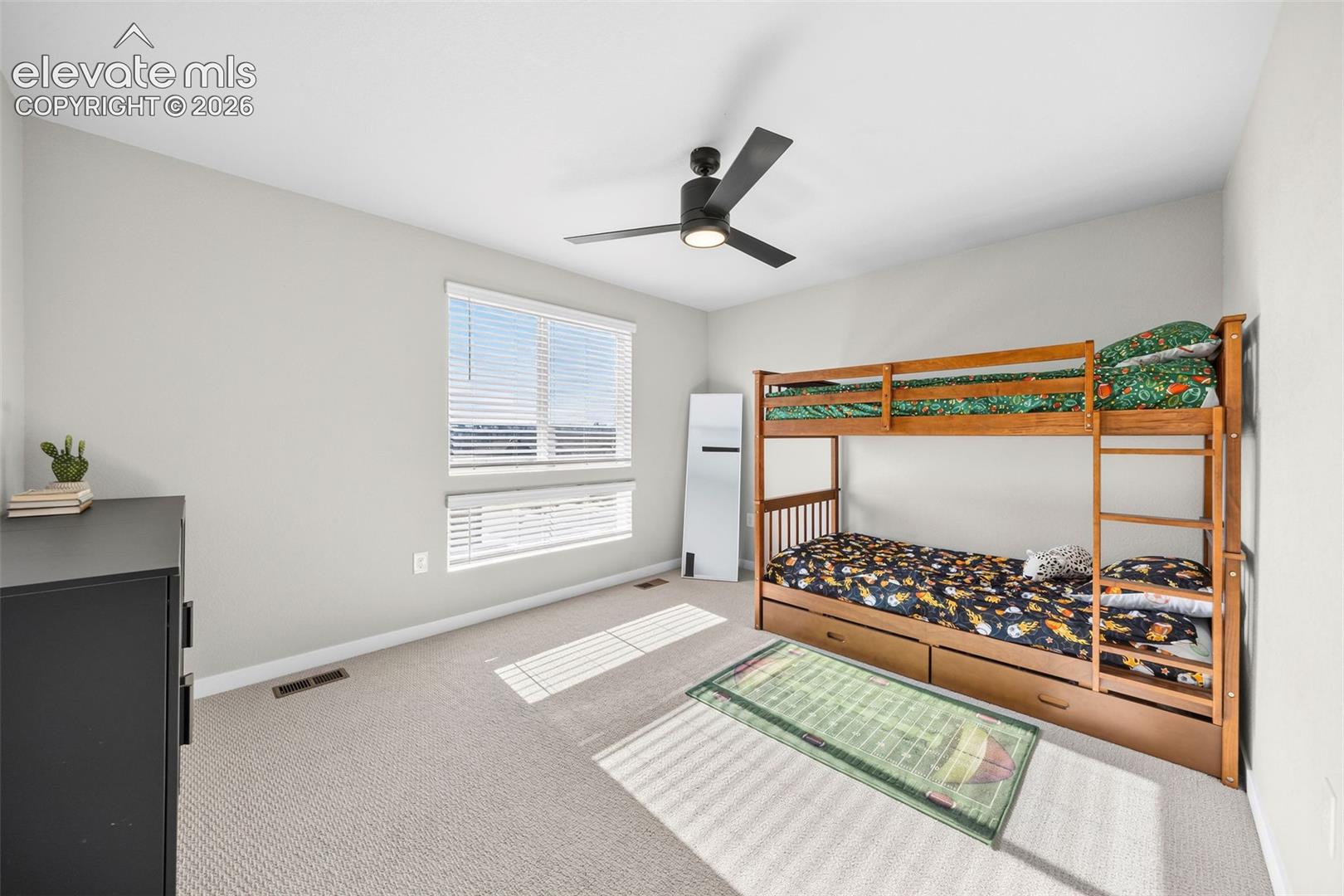The front-facing upstairs bedroom has its' own private full bath and views of the park. There is plenty of room in here for a queen-sized bed and all the furnishings you might want. 