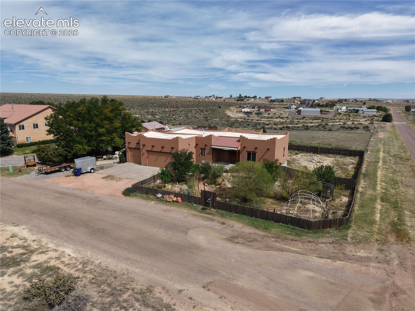 1.4 acres lot is fenced front and back and extends like a triangle behind the property.  No back side neighbors.