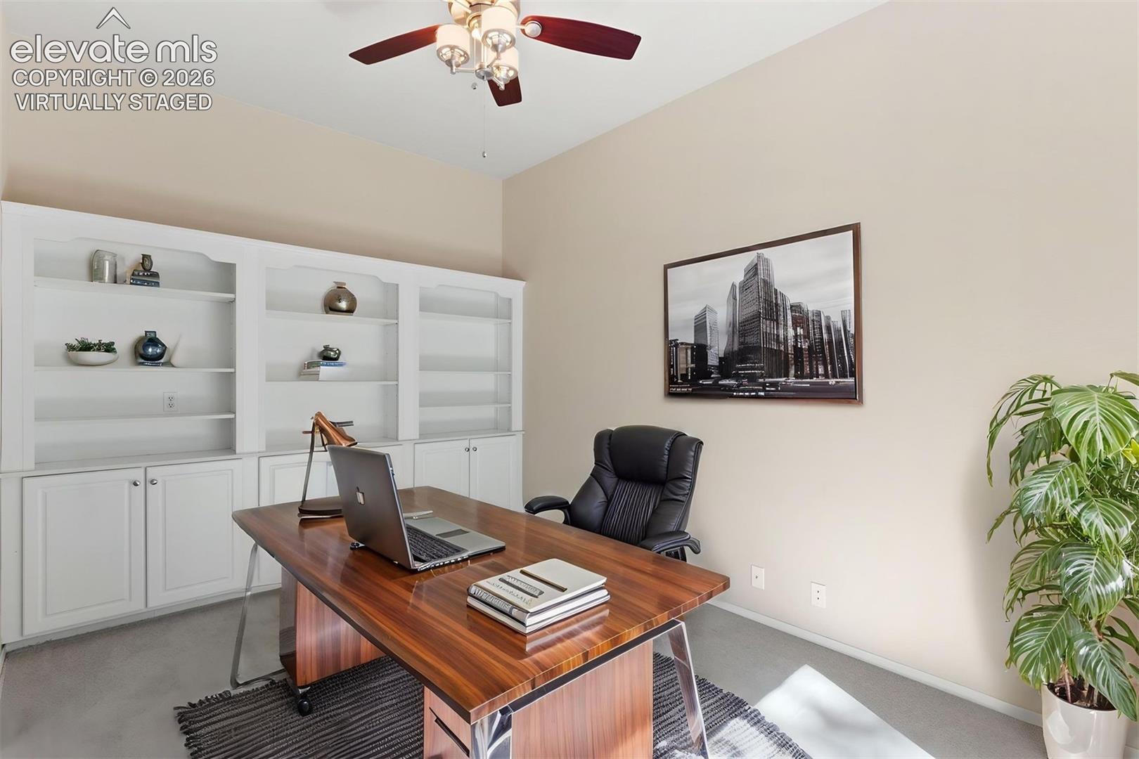 *virtually staged* Dedicated main level office with french doors and ceiling fan