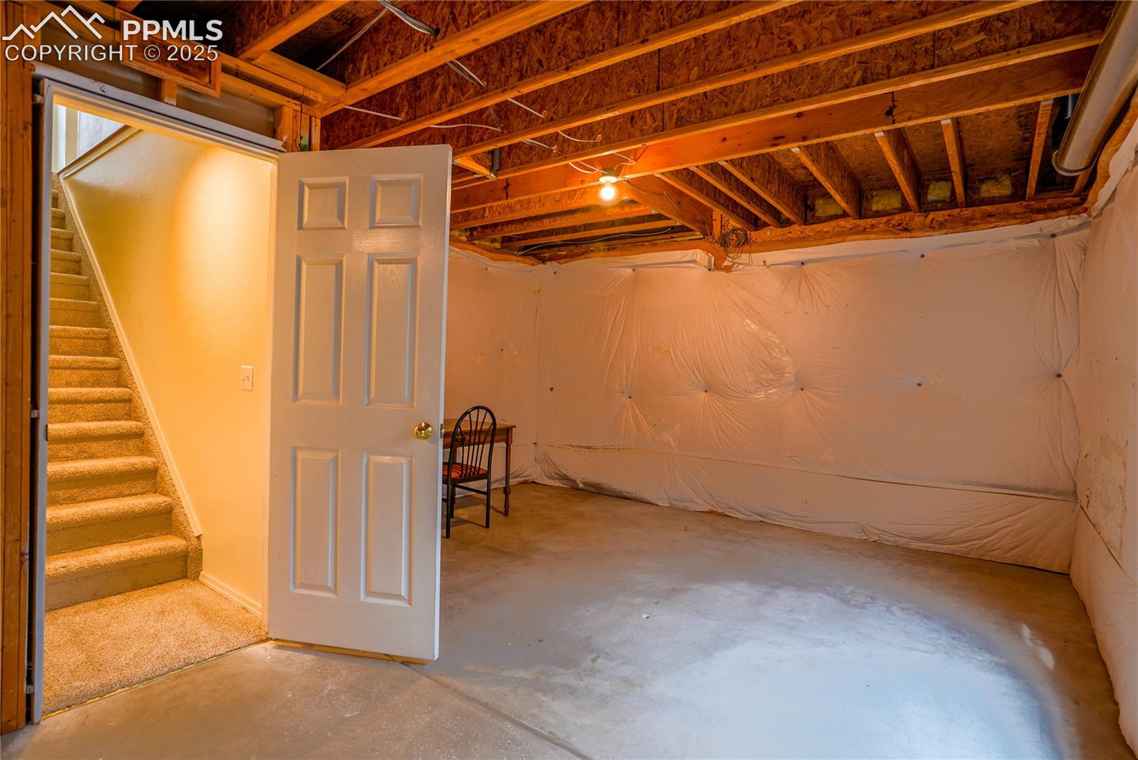Unfinished below grade area with stairway