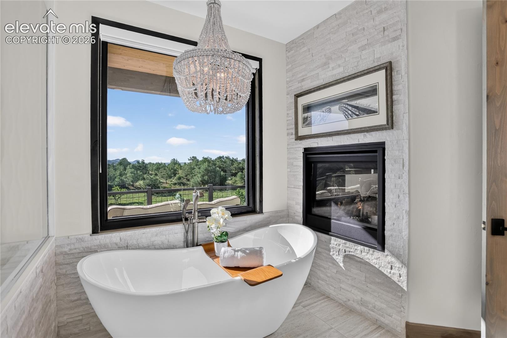 Double-sided fireplace & mountain views