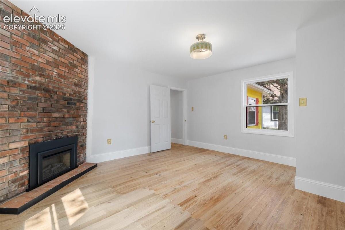 Vintage fireplace in 1 of the 3 bedrooms