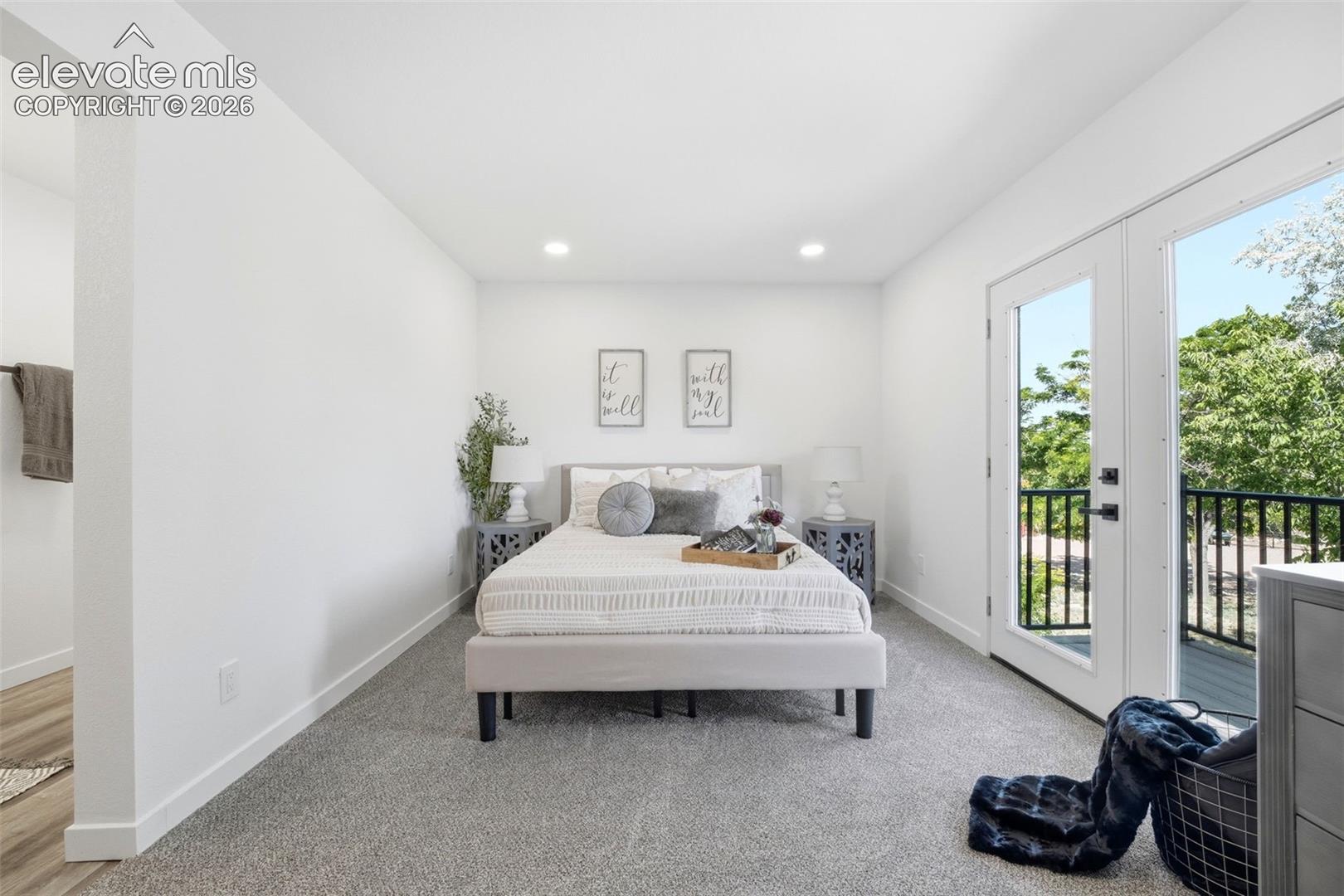 Bedroom featuring white walls, recessed lighting, and grey carpeting