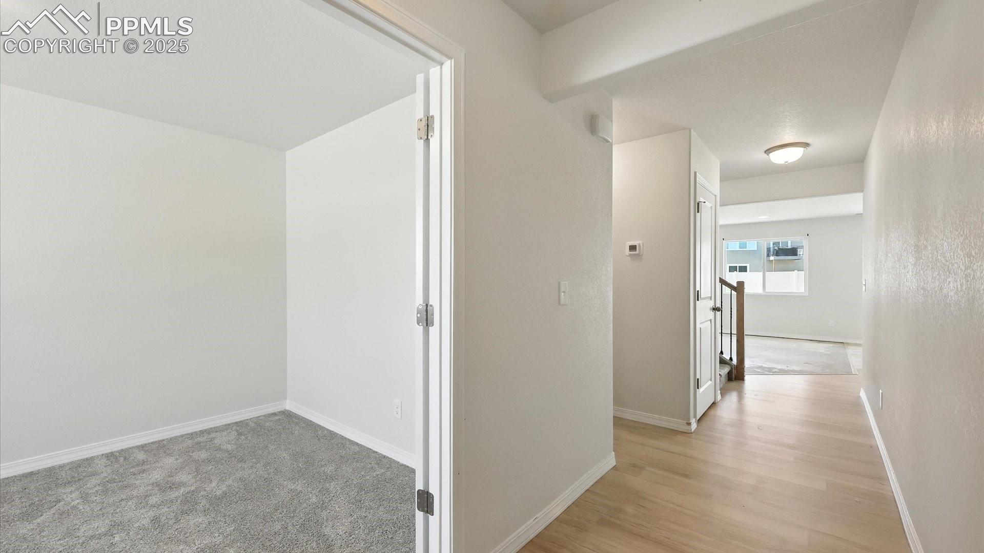 Attractive LVP Floors through the entry way into the Living Room.