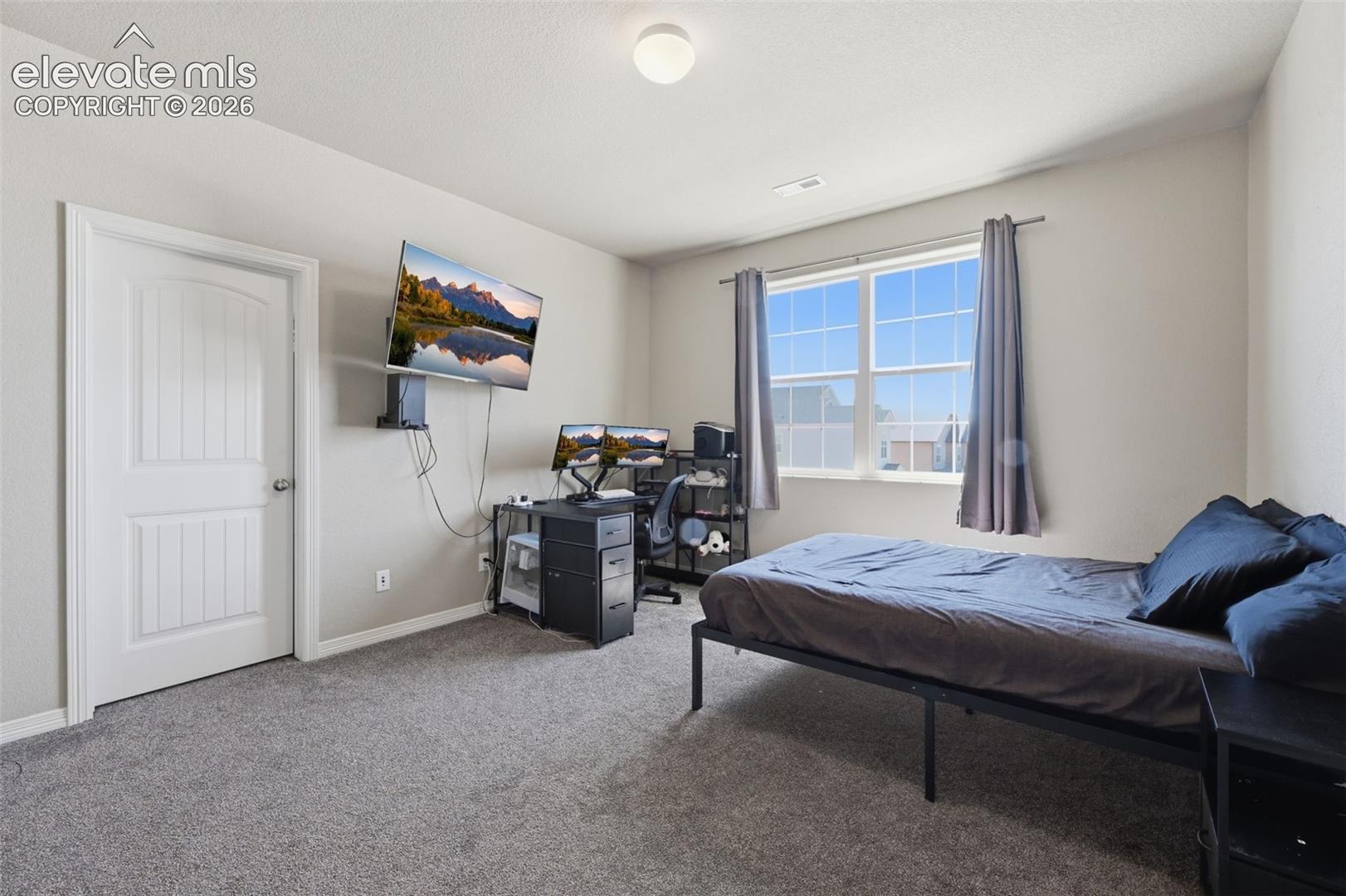 Generously Sized Secondary Bedroom With Space for Sleeping, Study & More