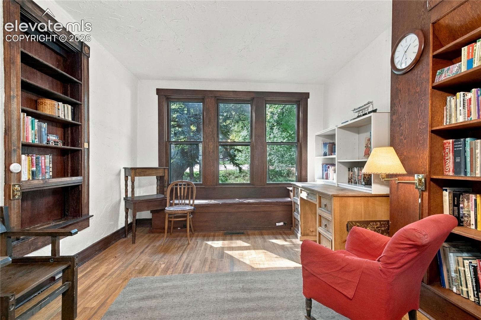 Built in bookcase and bench under the window in the dining room