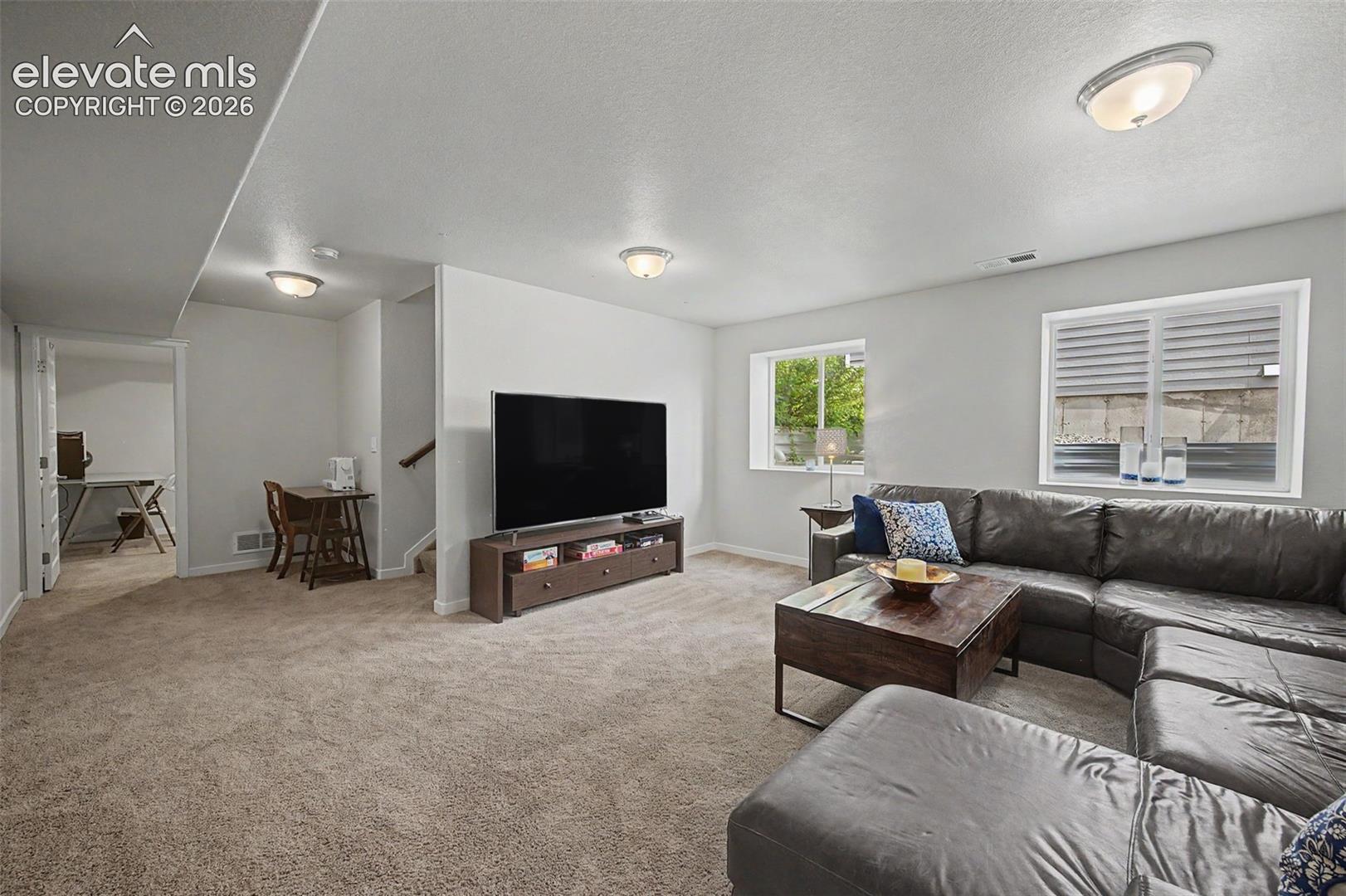 The basement family room is so spacious! Enjoy gatherings with family and friends here.