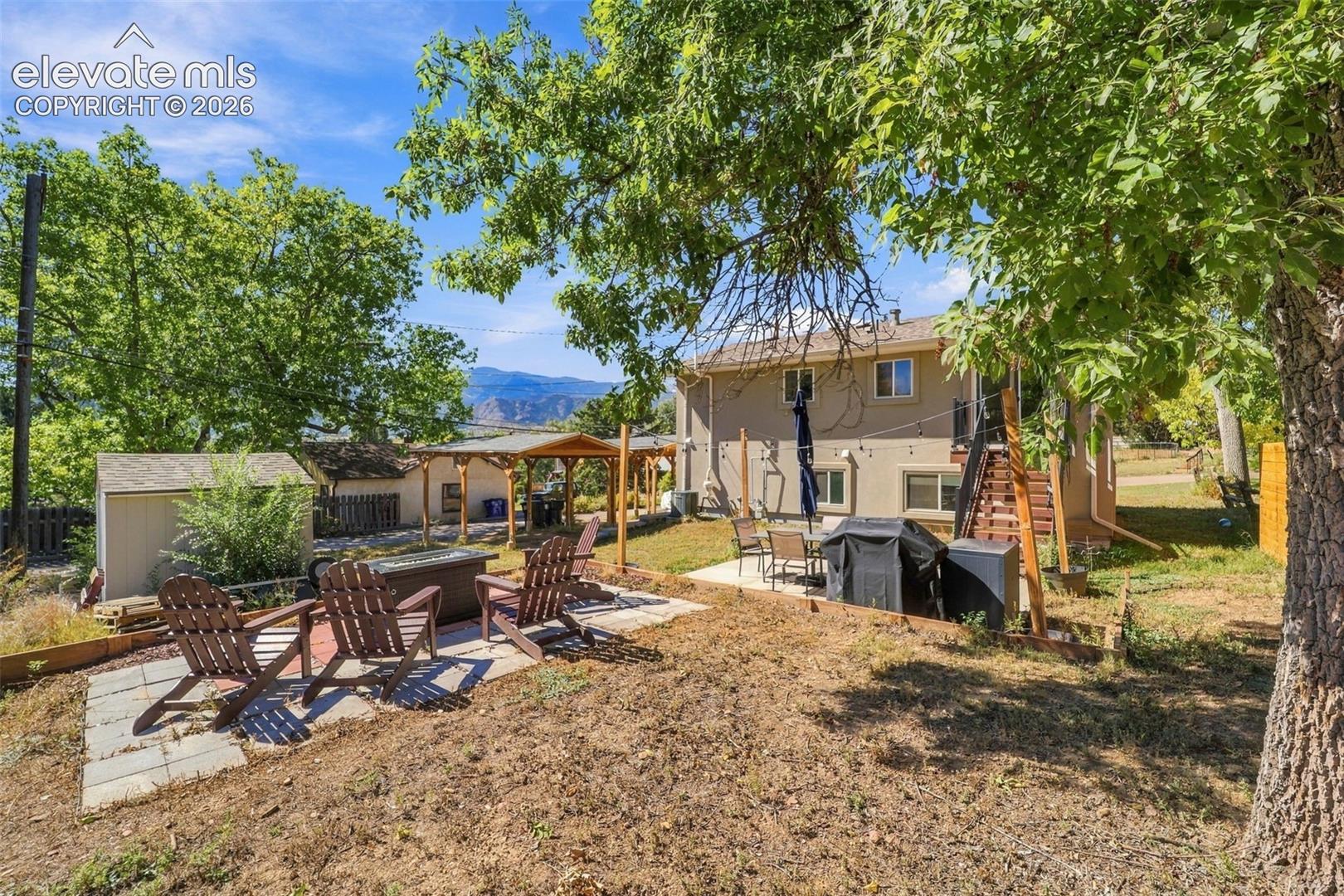 Back yard with multiple spaces for use! 