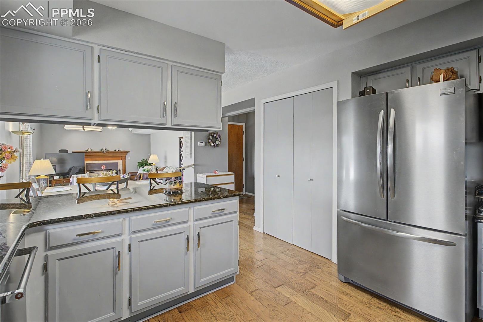 Kitchen with stainless steel appliances and pantry.