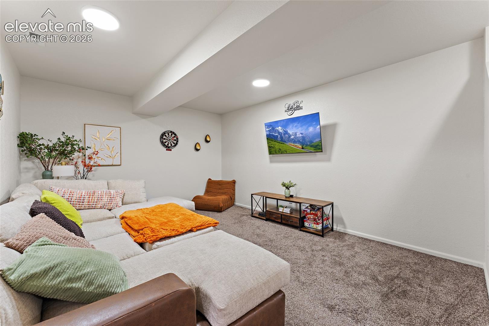 Interior room featuring neutral wall paint, wall-to-wall carpeting, and recessed ceiling lighting