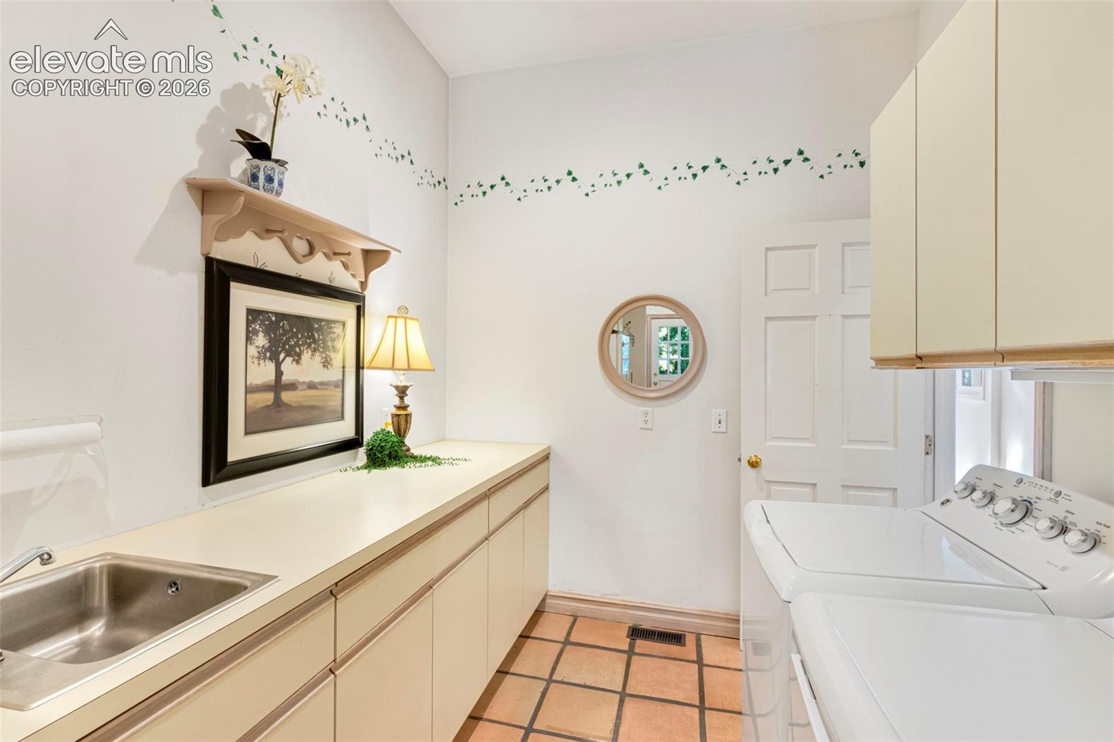 Laundry, with 1/2 bath, door to garage and workshop