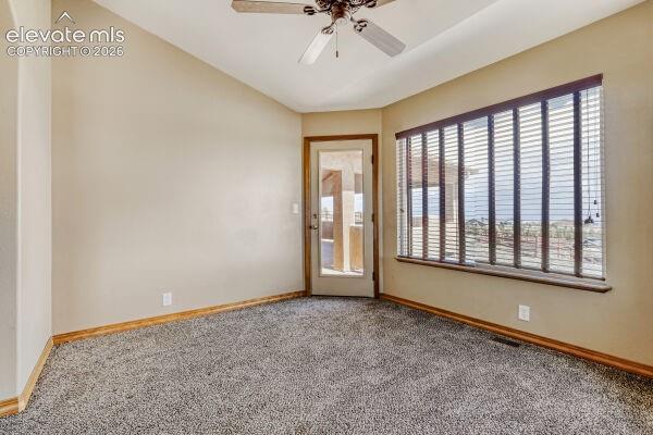 Primary Room Retreat with vaulted ceilings, plush carpeting, and a ceiling fan