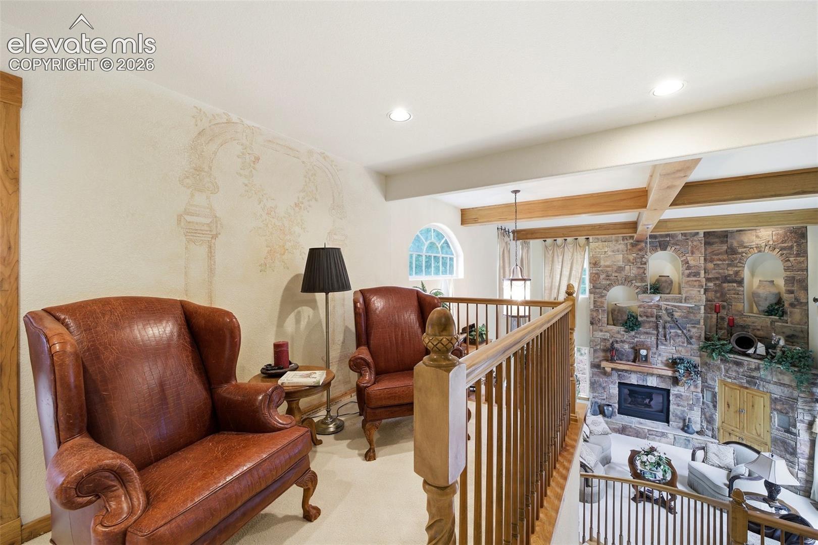 Upper level sitting loft overlooking great room