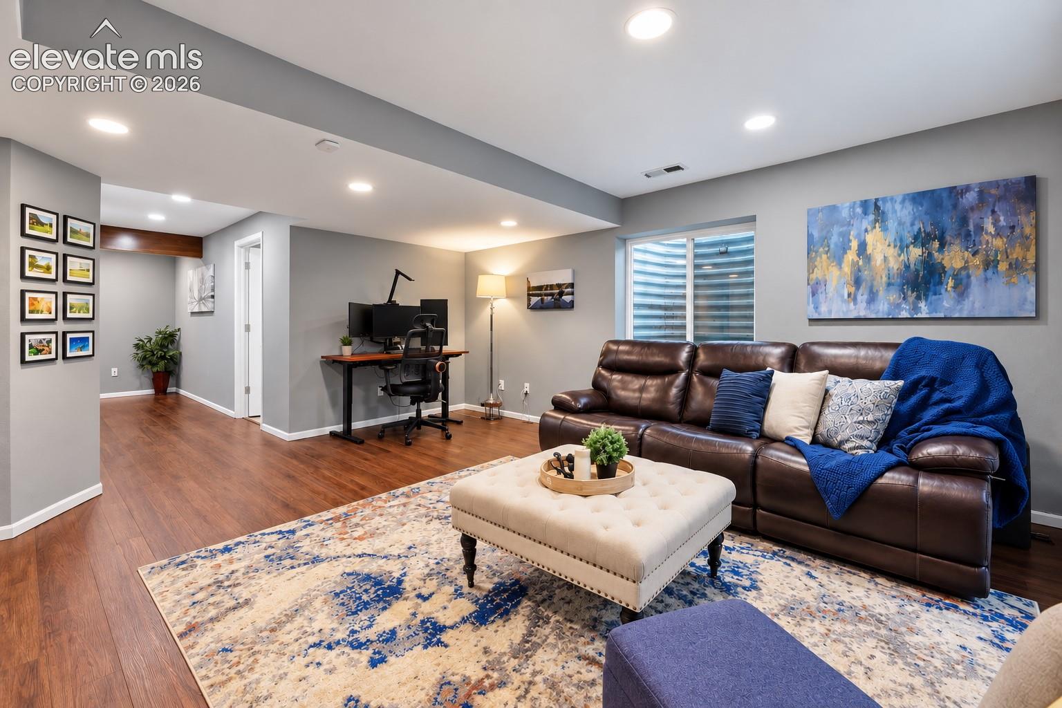 The lower-level family room connects easily to the hallway and full bath, creating a flexible and comfortable space for guests or everyday living.