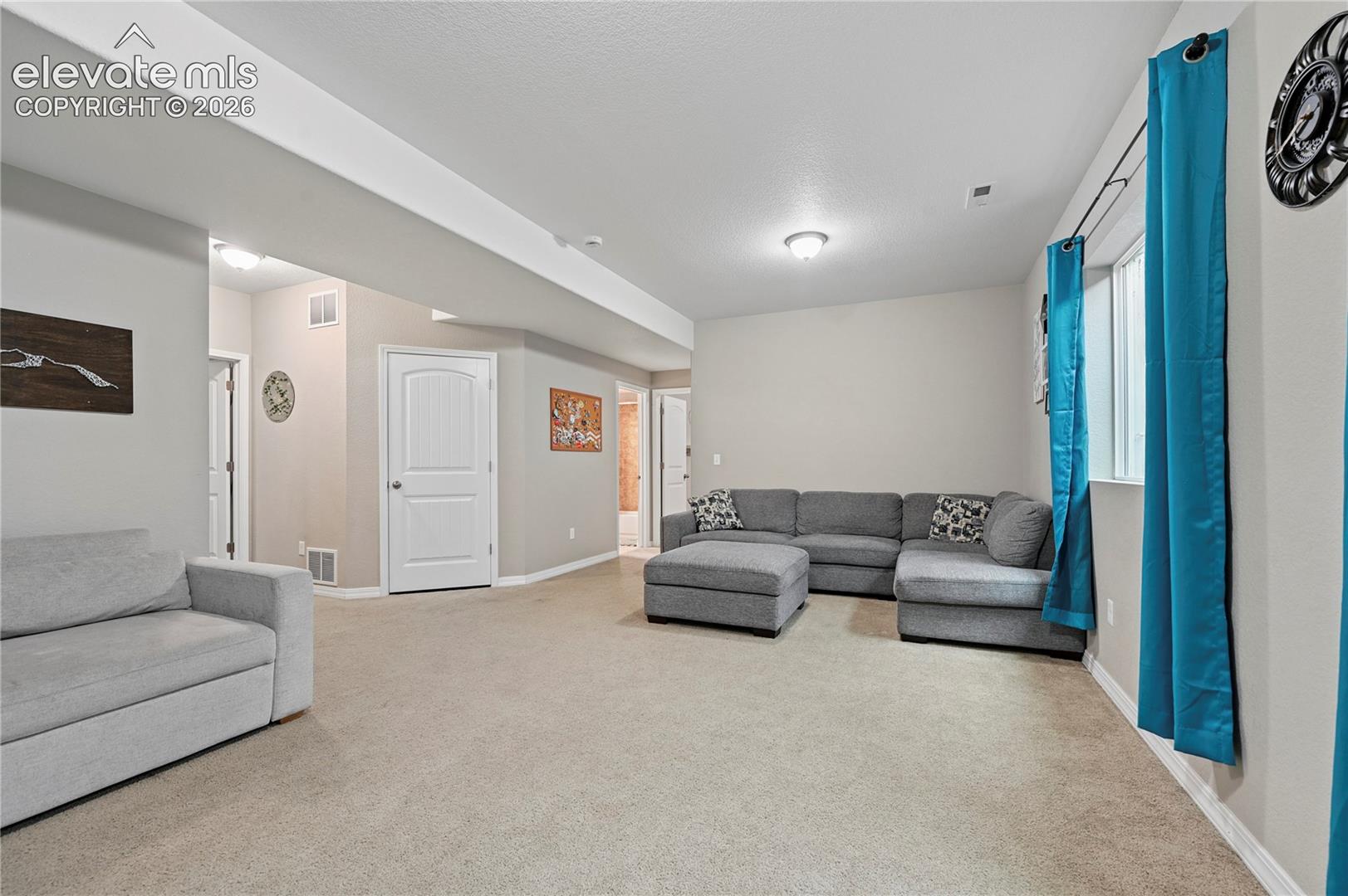 The family room separates the two additional basement bedrooms, giving them each the most private feeling of all the bedrooms.  The extra-height basement ceilings really make the space feel less basement-y.