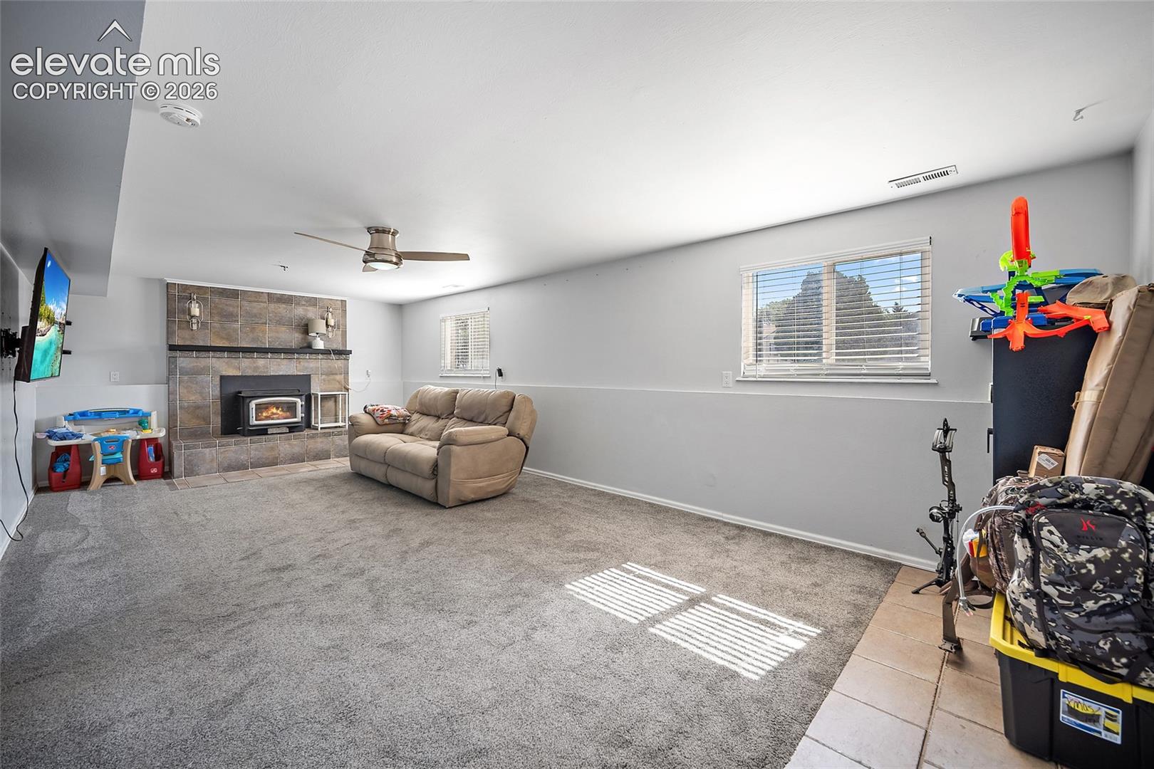 Family room with fireplace and natural light.