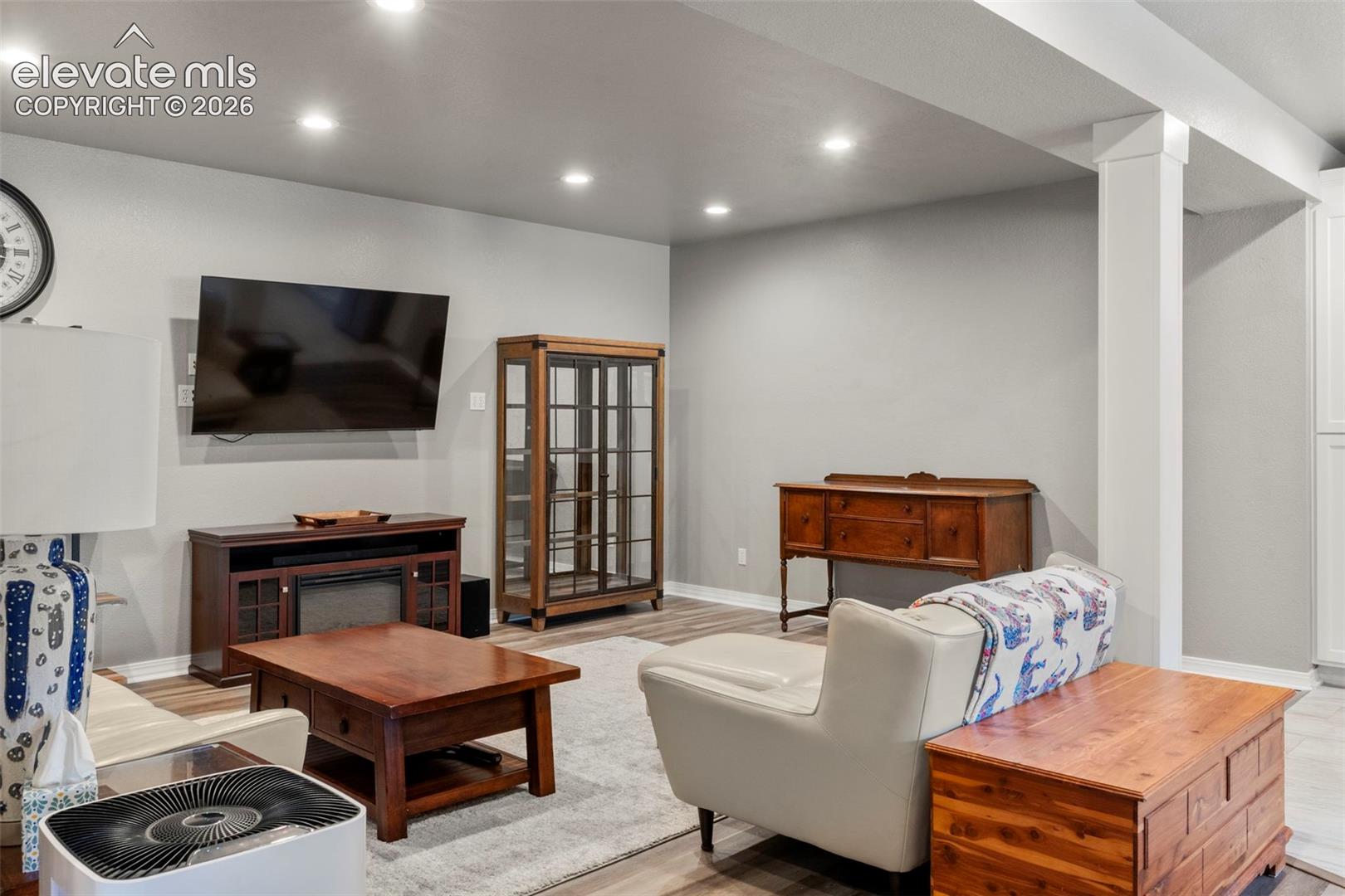 Living area featuring recessed lighting and light wood finished floors