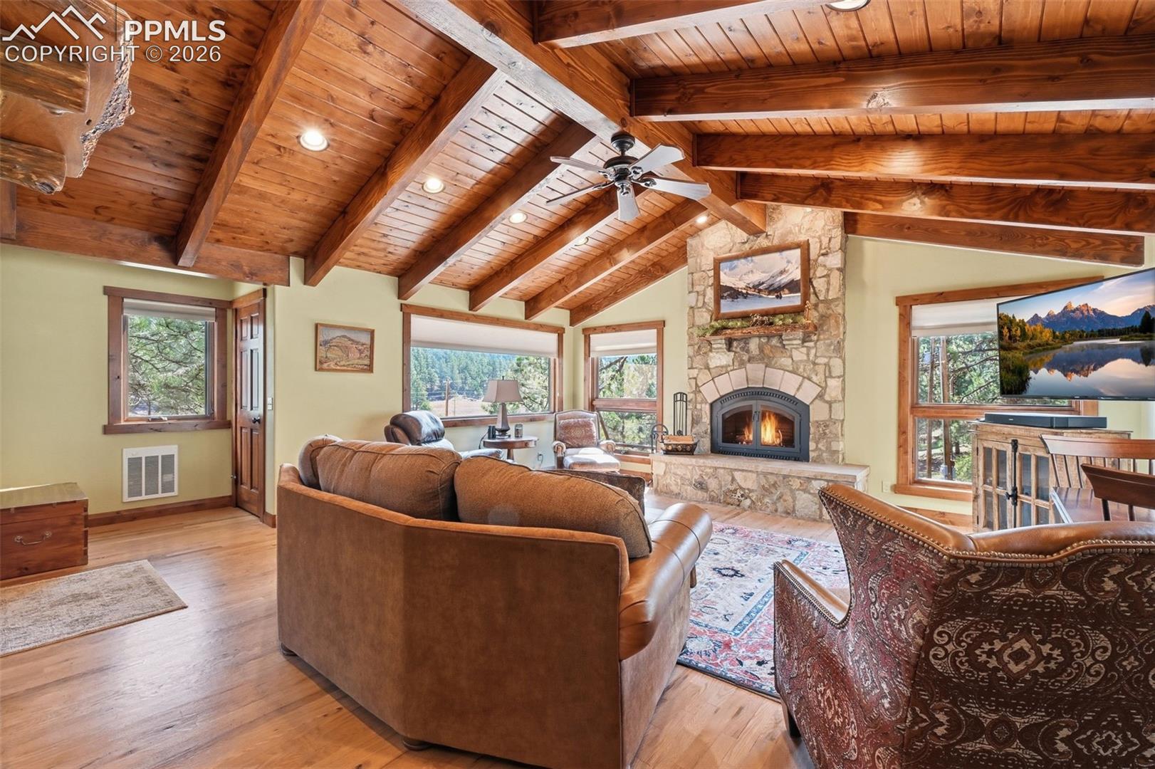 Natural hardwood floors compliment the exquisite ceiling, creating a room that is both relaxing and mesmerizing.  