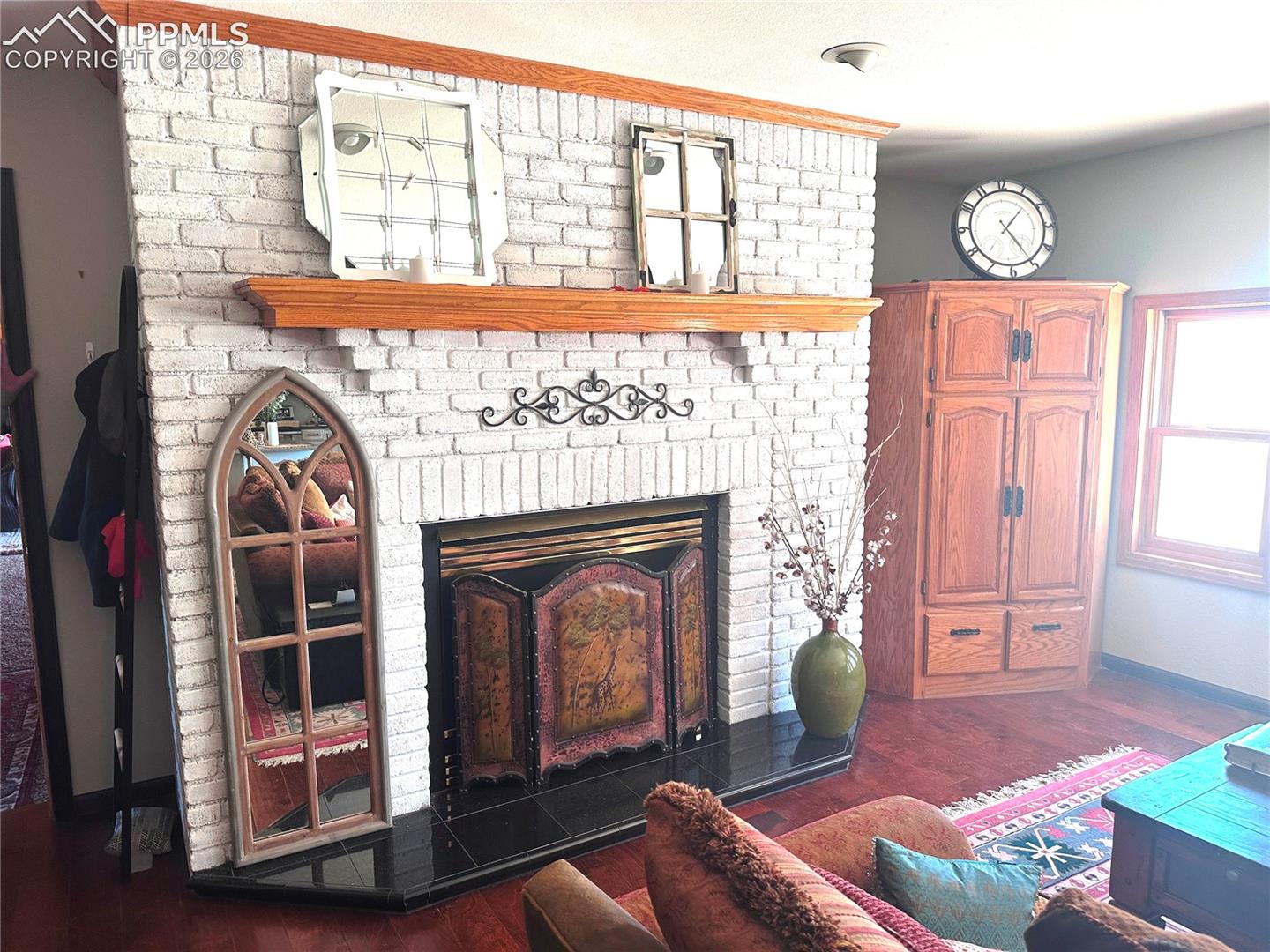Living room has propane gas fireplace as does primary bedroom fireplace. In floor radiant heat but no central air, but ceiling fans, operable windows and 2 mini-portable ac units will stay as well for use during peak cooling needs.