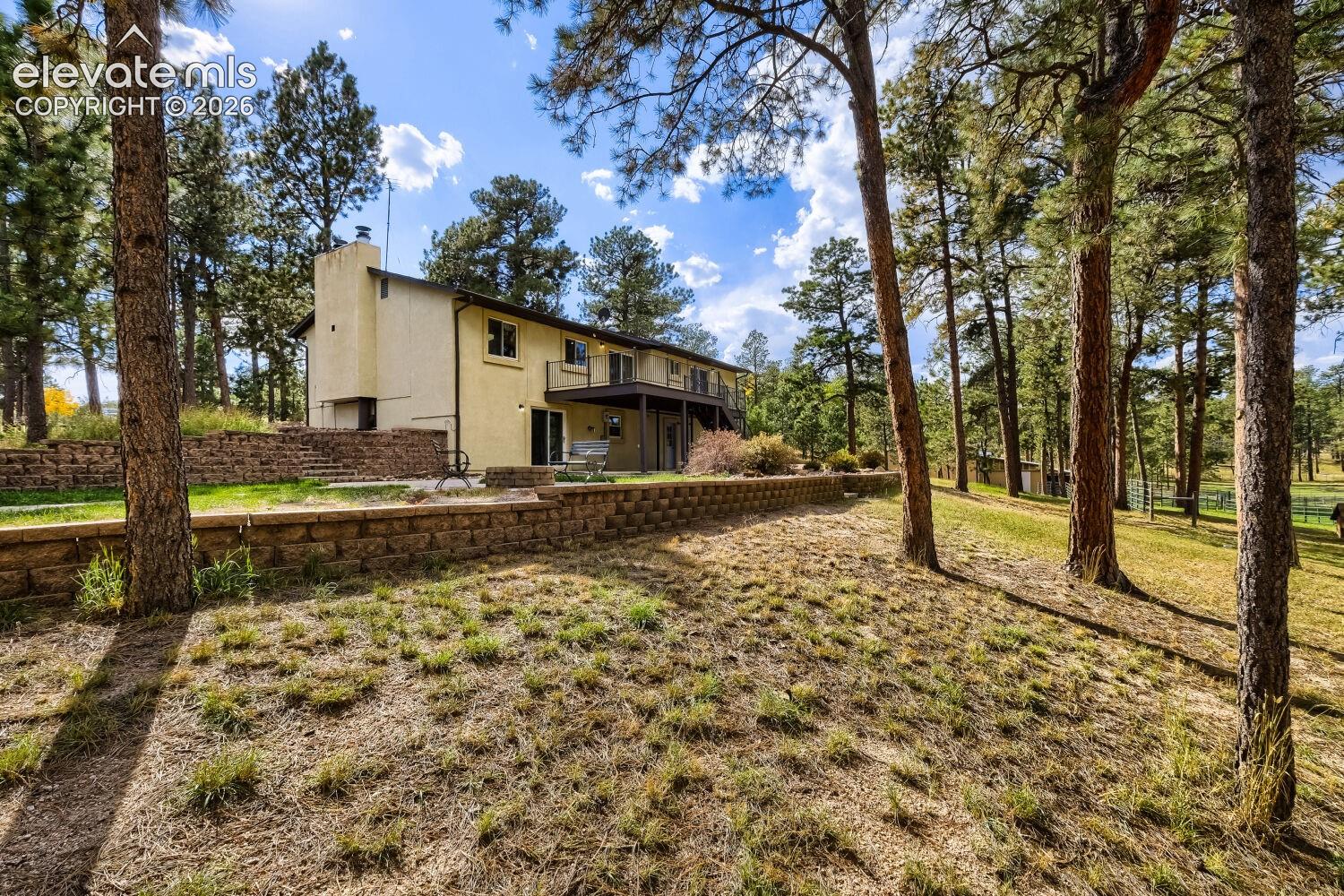 Exterior stucco finish with a prominent chimney