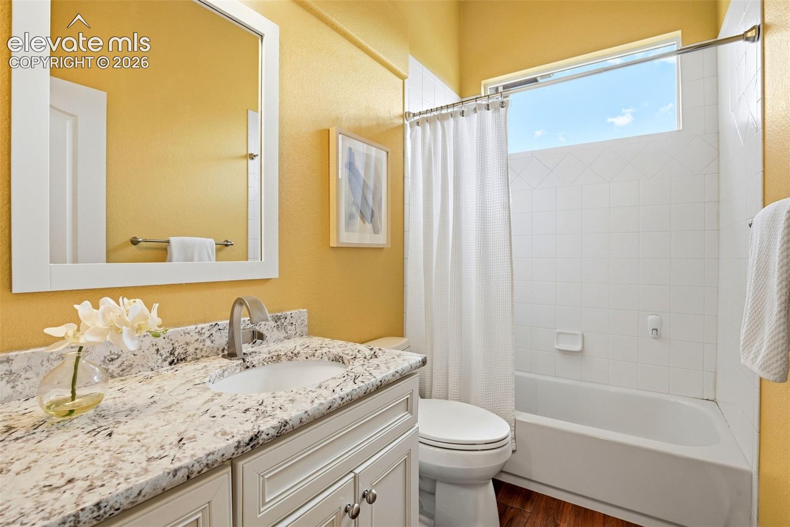 One of three full baths updated with a beautiful wood look porcelain tile - clean modern look