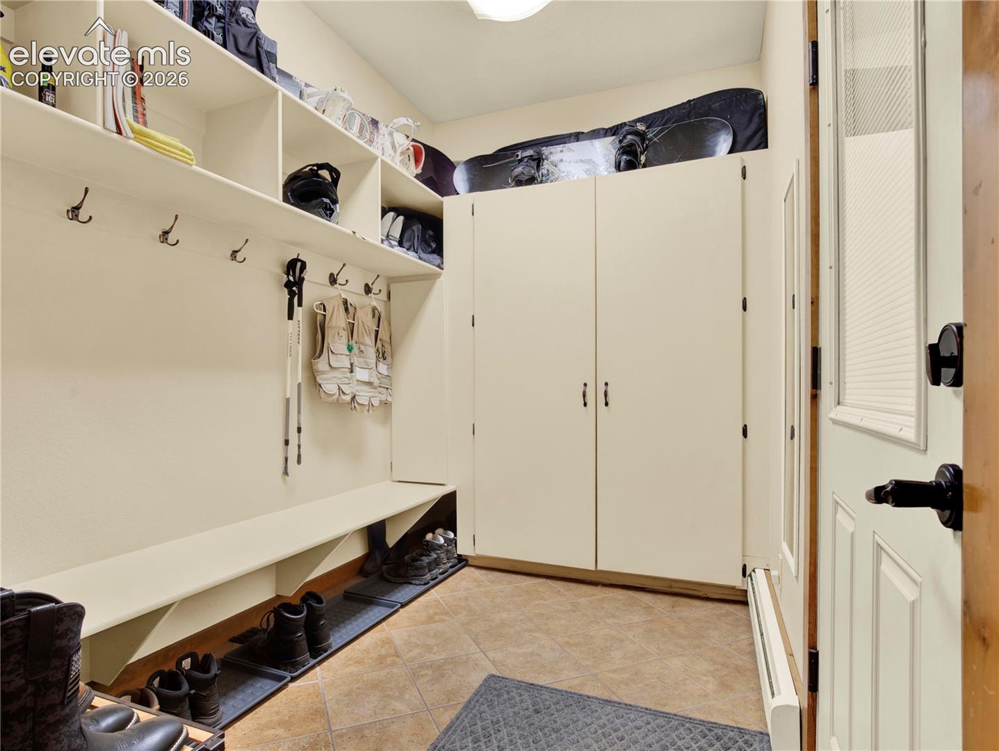 Full large mud room located between the lower level entertainment area and the garage