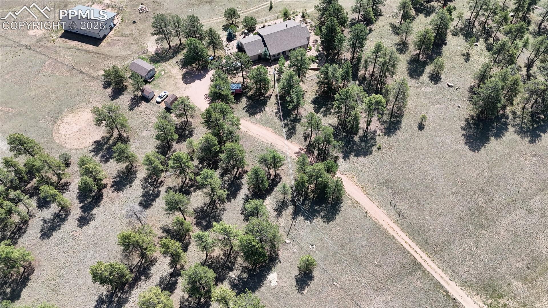 Aerial view of property and surrounding area with rural landscape