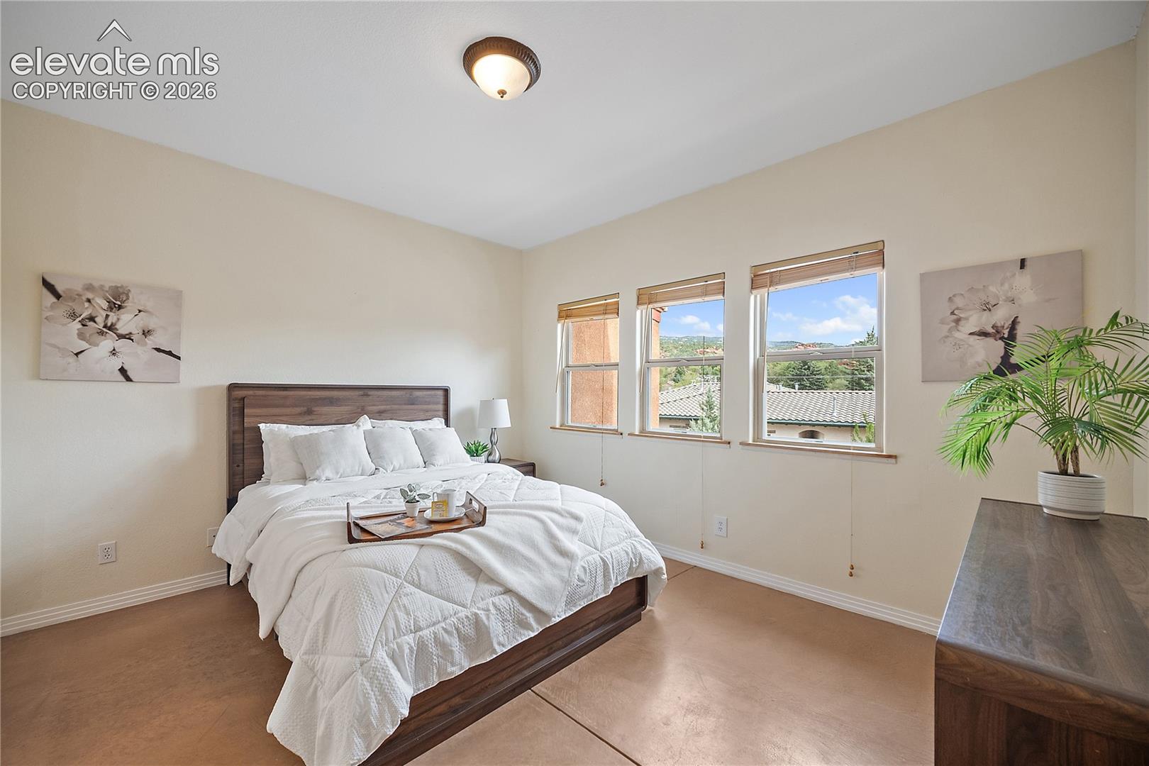 Main level primary suite that is open an bright. 