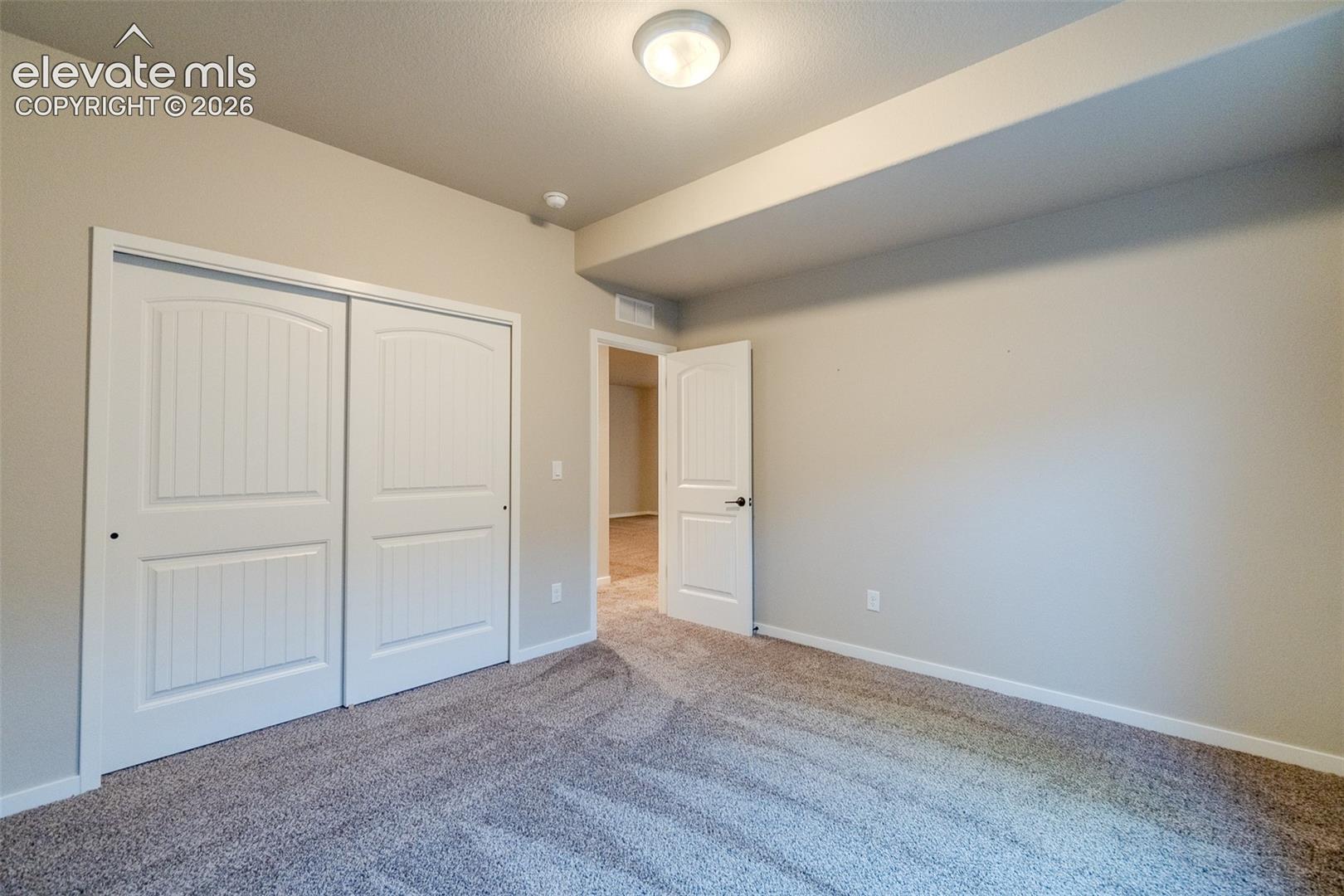 Neutral tone walls with white trim throughout