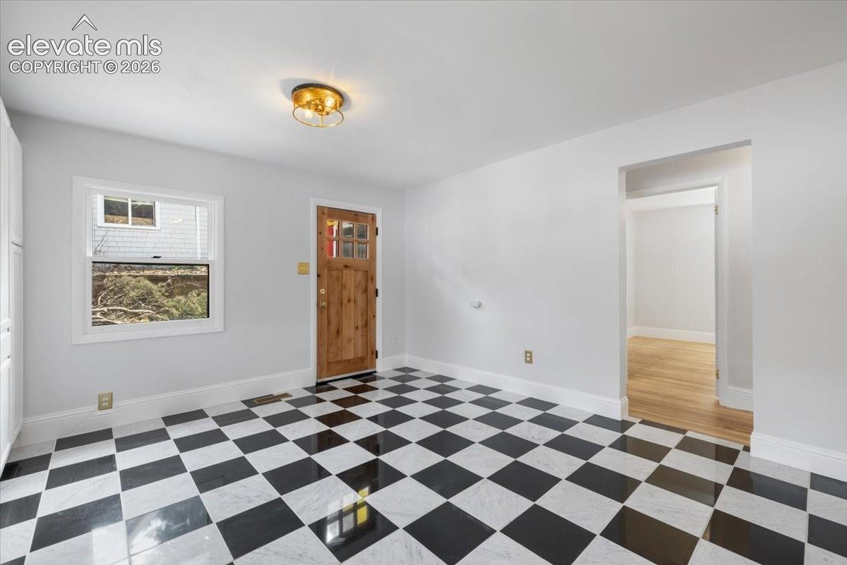 Eat-in kitchen with door to back patio