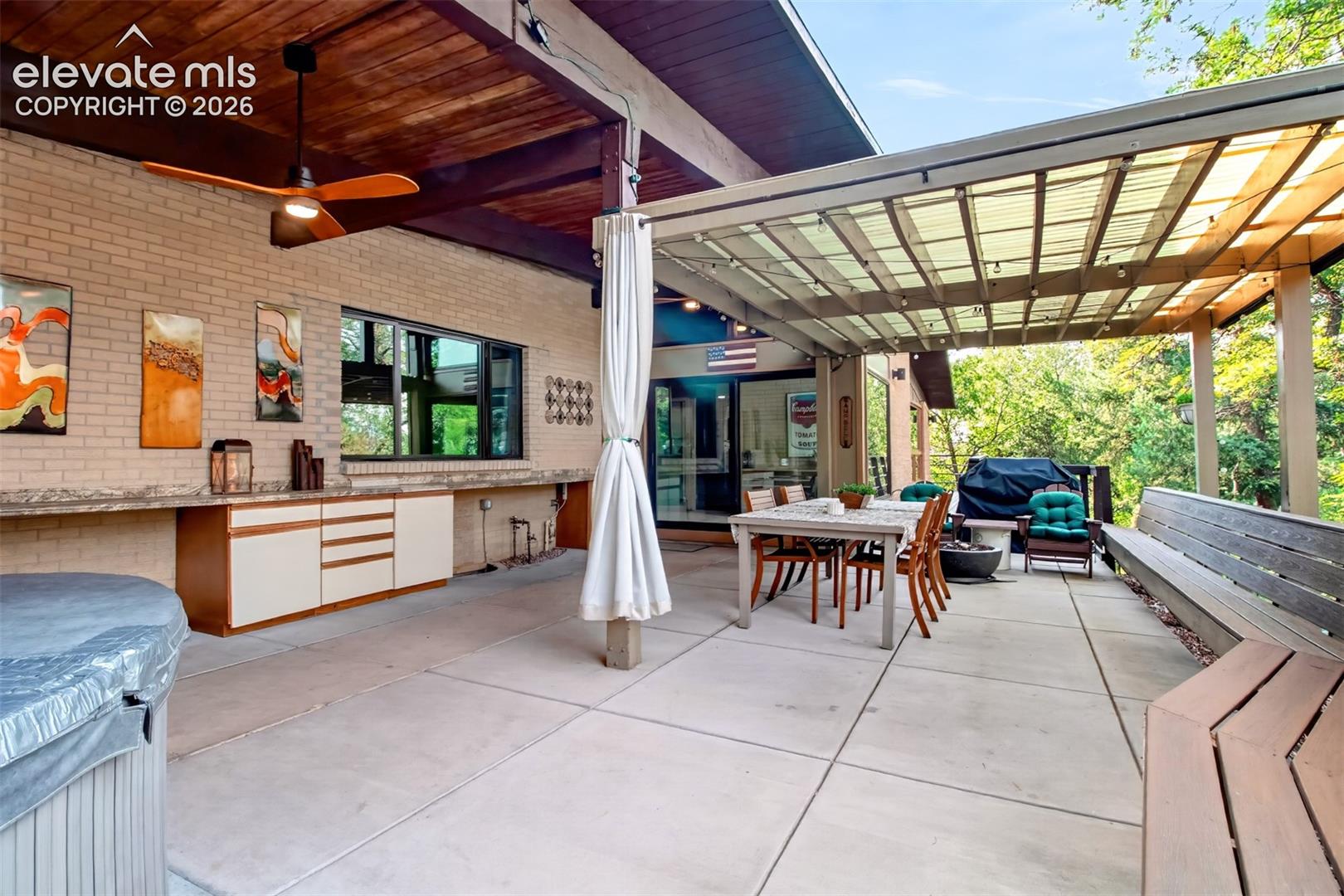 Built in cabinets and countertop along the back of the home serve the covered patio
