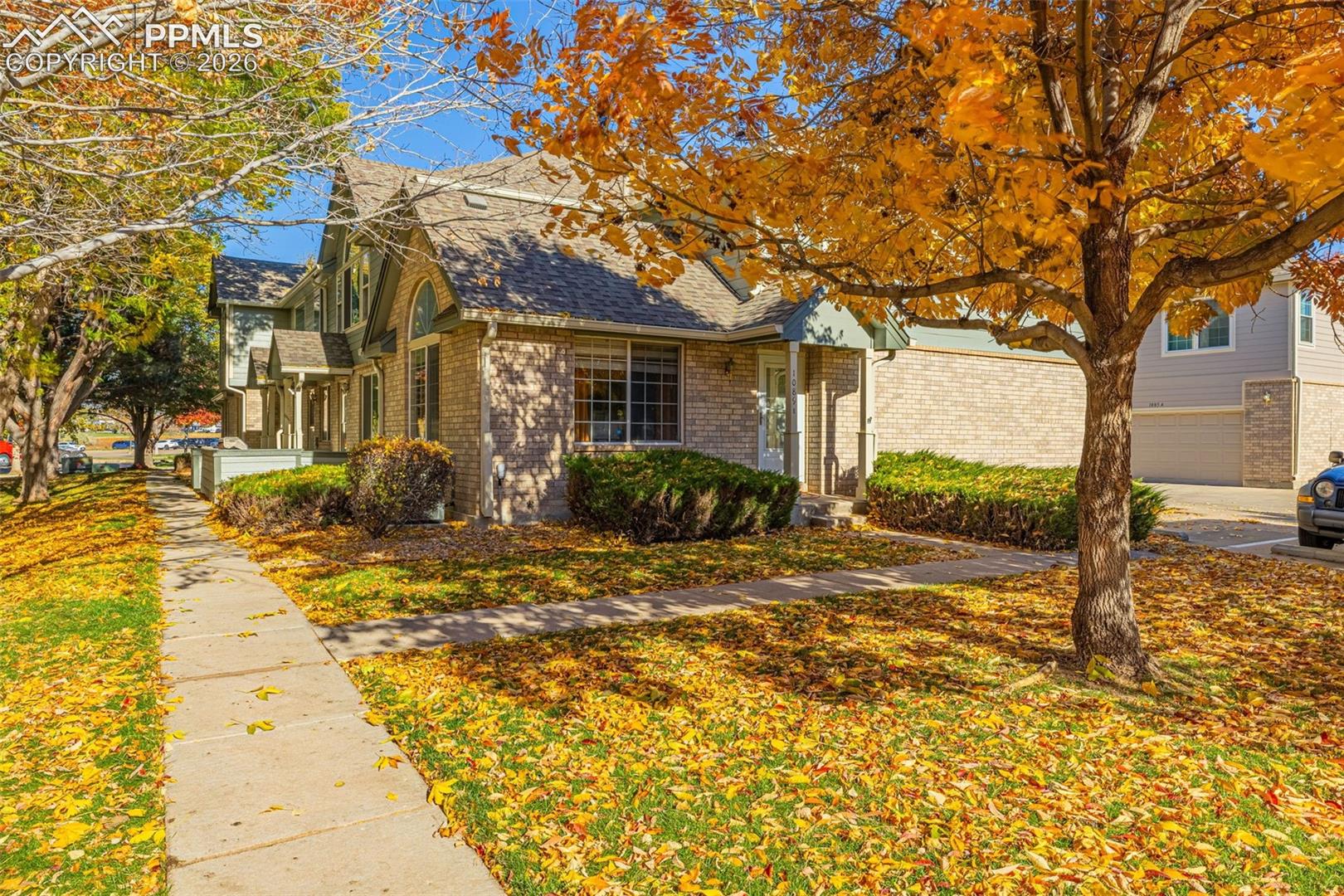Welcome to this beautifully maintained home that is completely move in ready with two bedrooms!  Step inside to discover soaring ceilings, abundant natural light, and stunning wood-style flooring that flows through the main level. The spacious living room features a cozy stone-surround fireplace, creating the perfect spot to unwind or entertain. Just off the living area, the dining space is accented by a custom wood-accent wall and opens seamlessly to the patio ideal for morning coffee or weekend barbecues. The updated kitchen boasts white cabinetry with gold hardware, sleek quartz countertops, stainless-steel appliances, and modern pendant lighting, offering both functionality and elegance. Upstairs, the large primary suite provides a peaceful retreat with plush brand new carpet, oversized windows, and generous closet space. A beautifully refreshed full bath and secondary bedroom complete the upper level. Additional highlights include in-unit laundry, a well-maintained community setting with mature trees and open green space. Residents of Cottonwood Villas enjoy access to a community pool, clubhouse, and walking paths, all within minutes of shopping, dining, parks, and major commuter routes. With its inviting atmosphere, stylish updates, and prime location, this home perfectly blends comfort, convenience, and charm.
