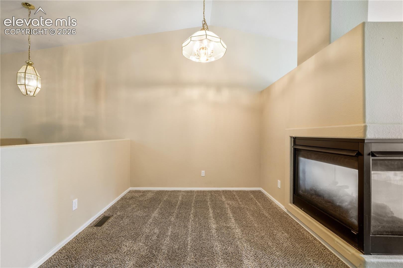 Dining area between kitchen eat in area and living room