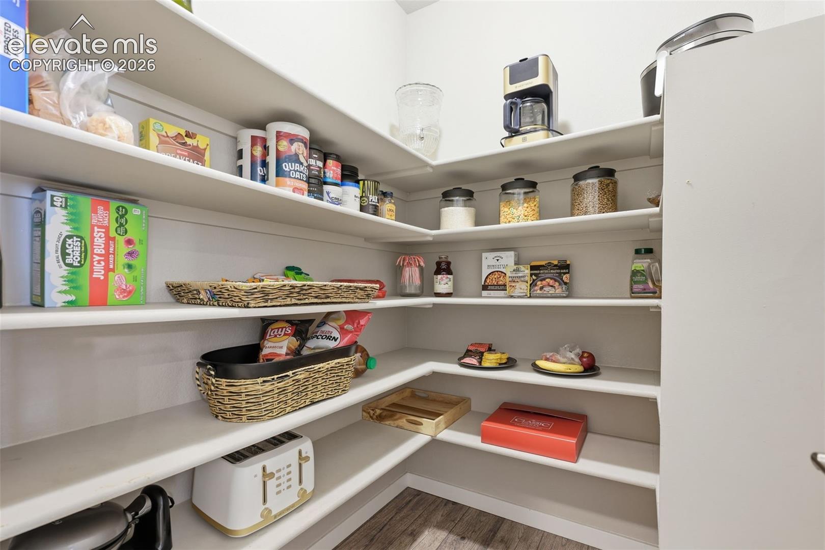 Wraparound shelving providing extensive storage.