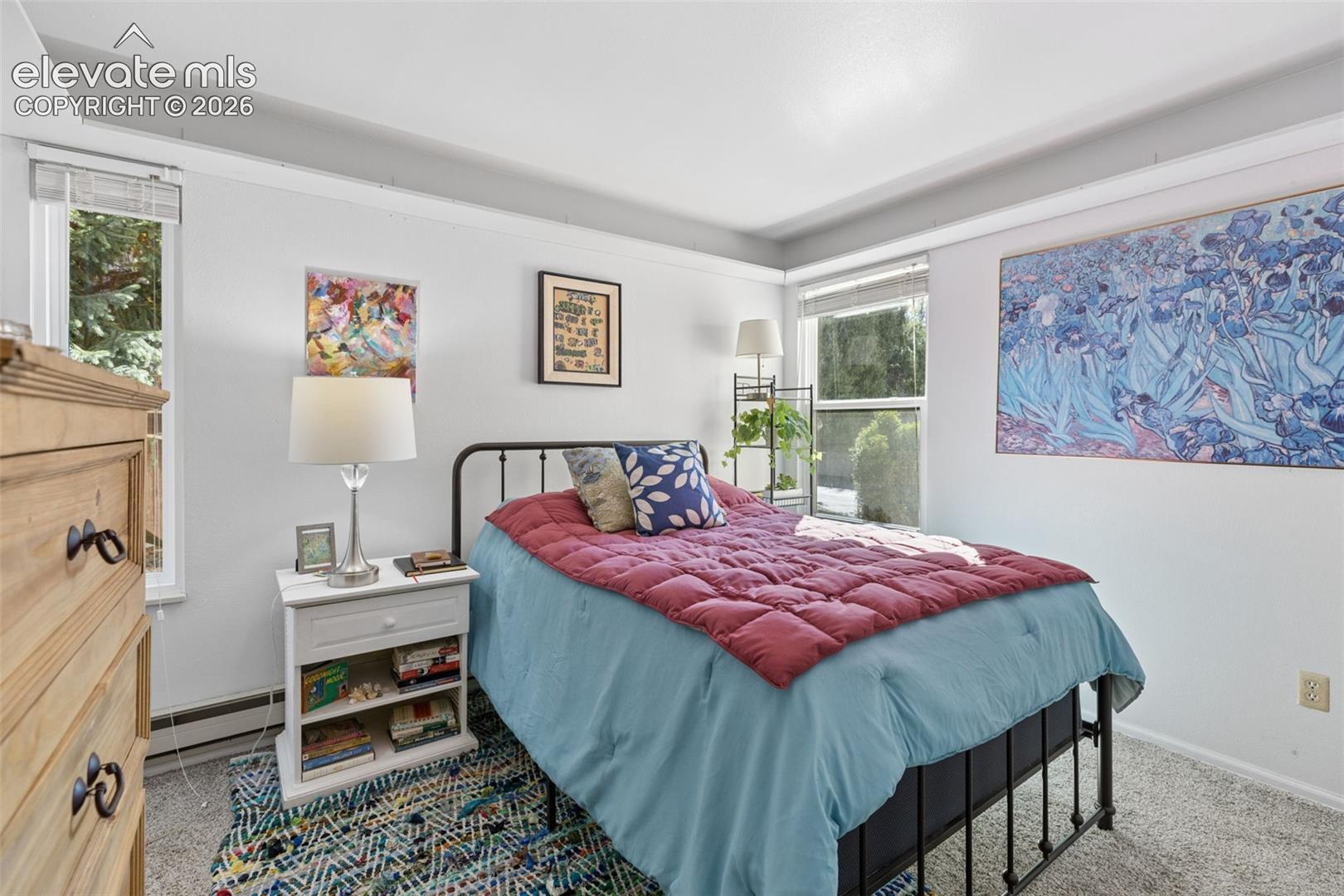 Recessed window with blinds, light-colored wall paint, white trim, and light gray carpeting